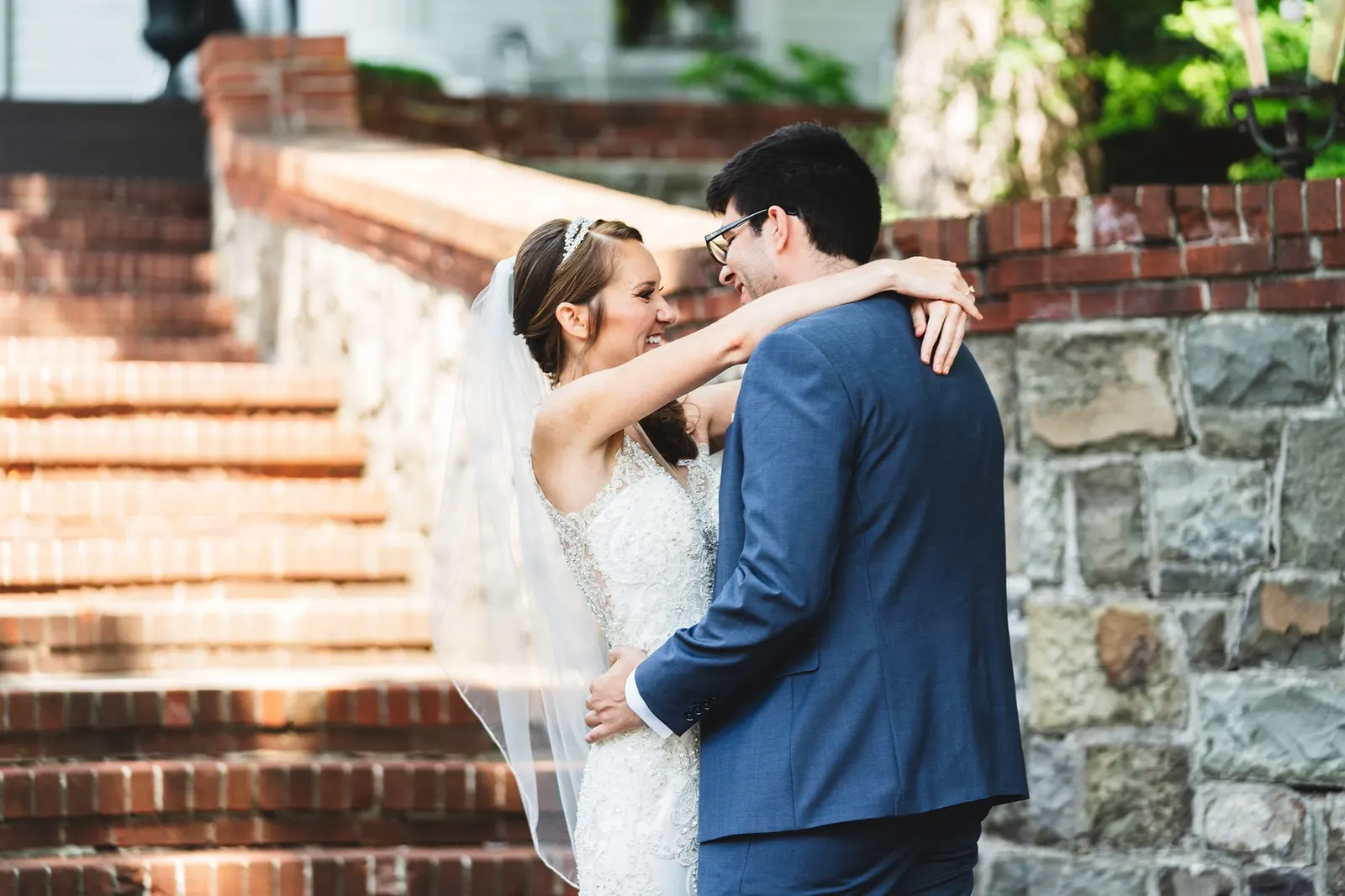 Bride and groom embracing after their first look
