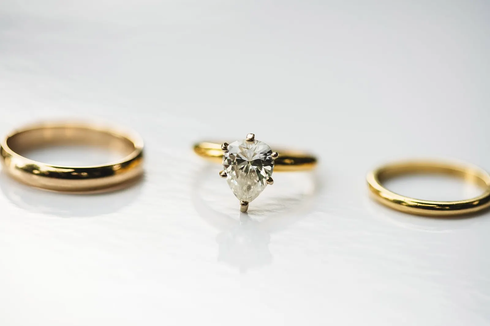 Engagement ring and gold wedding bands