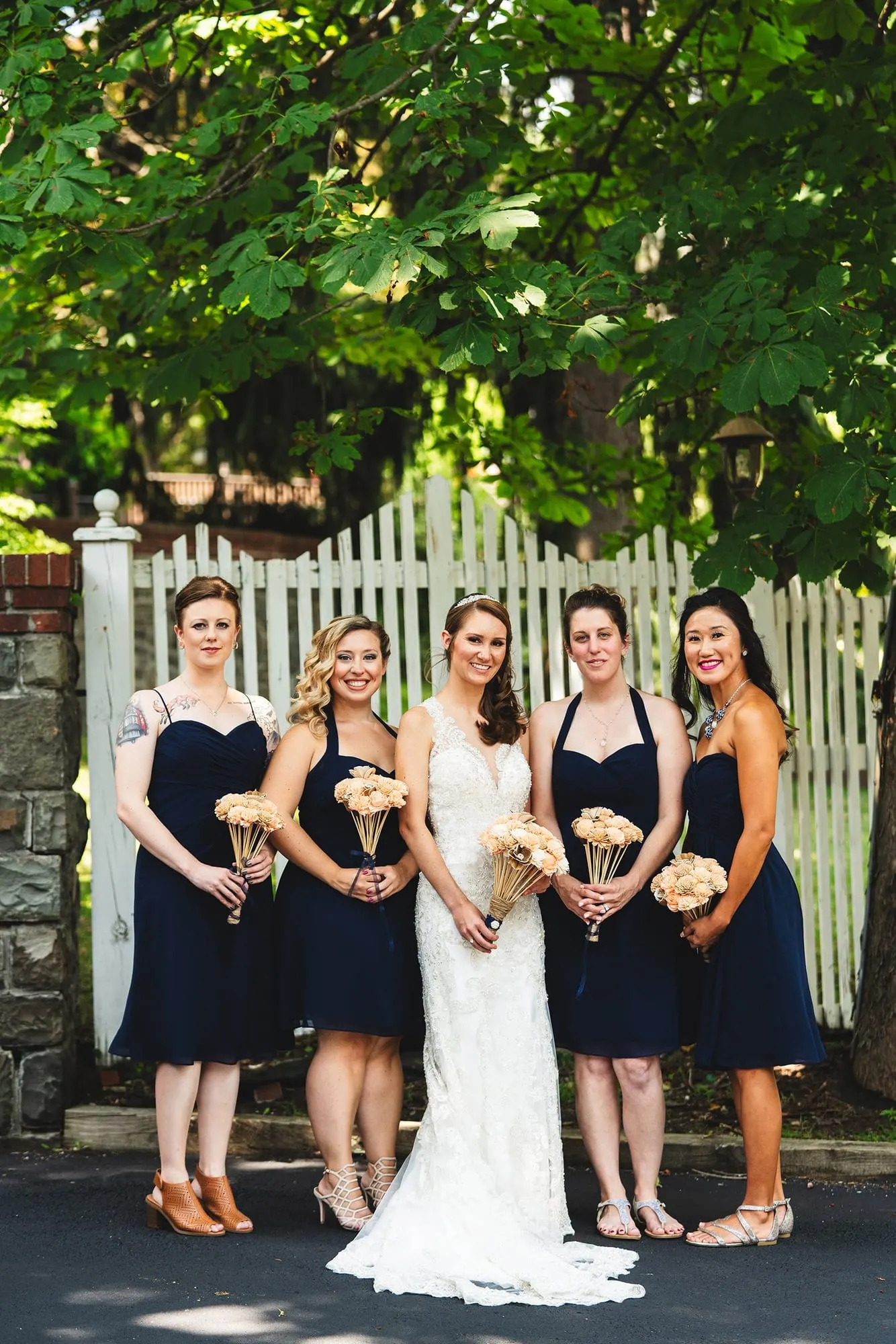 Bride with her bridesmaids in navy dresses