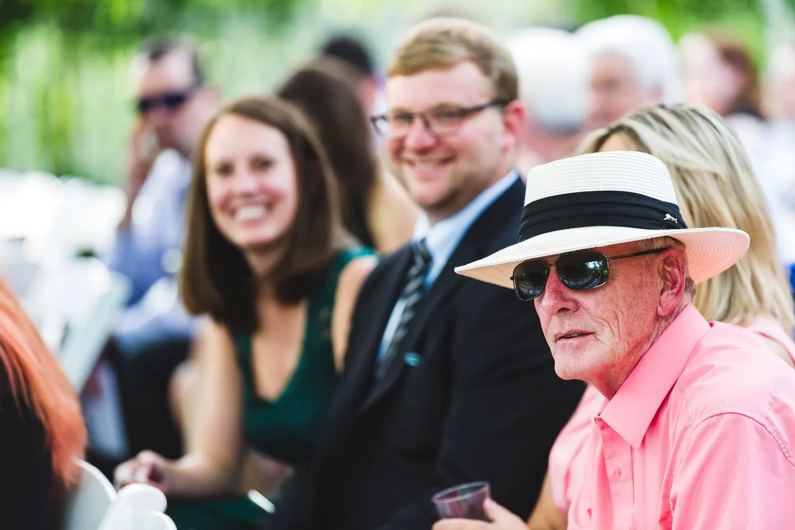 Guests smiling as they wait for the ceremony to begin
