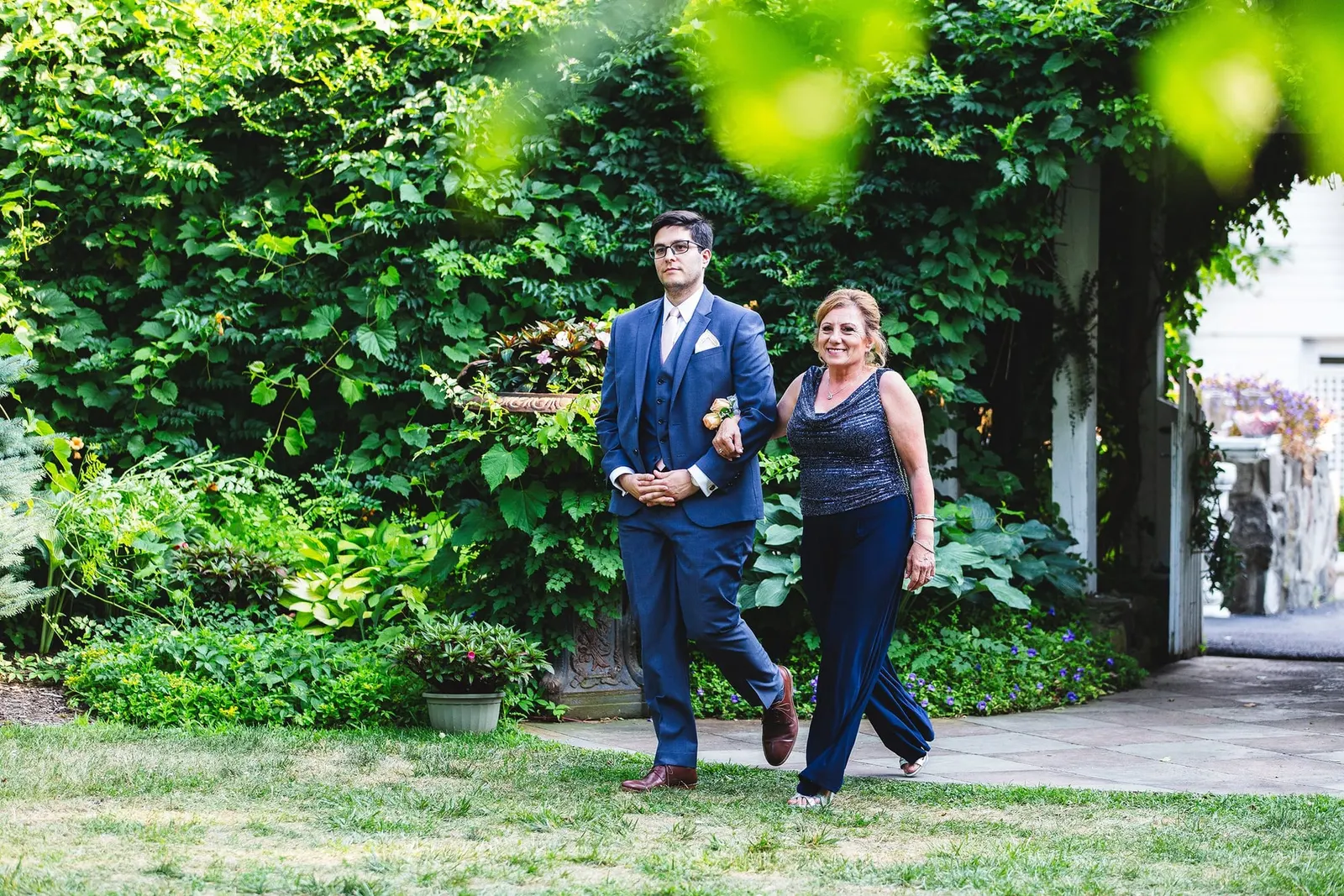 Processional crossing the lawn toward the ceremony