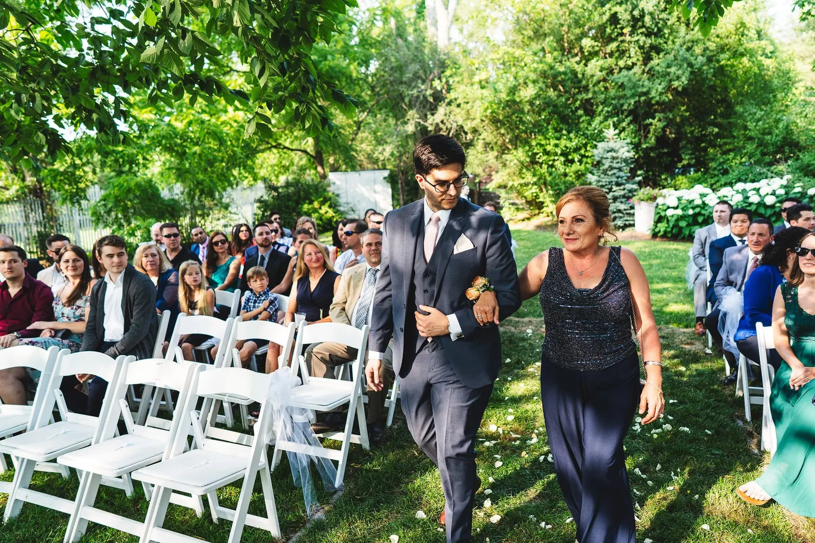 Processional down the aisle past seated guests