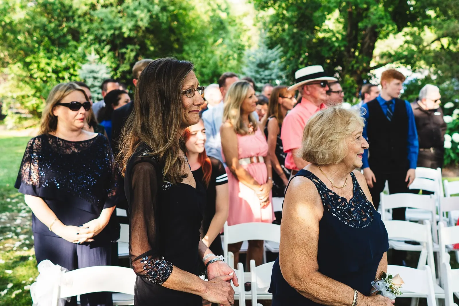 Guests watching the outdoor ceremony