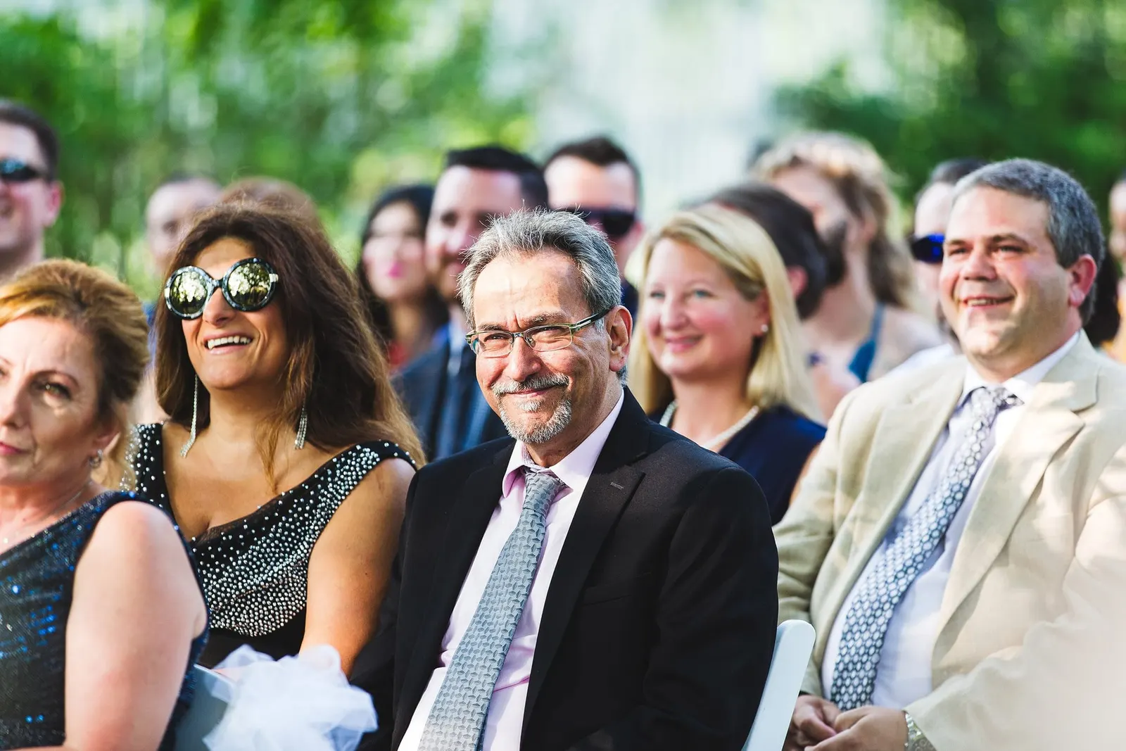 Guests smiling during the ceremony