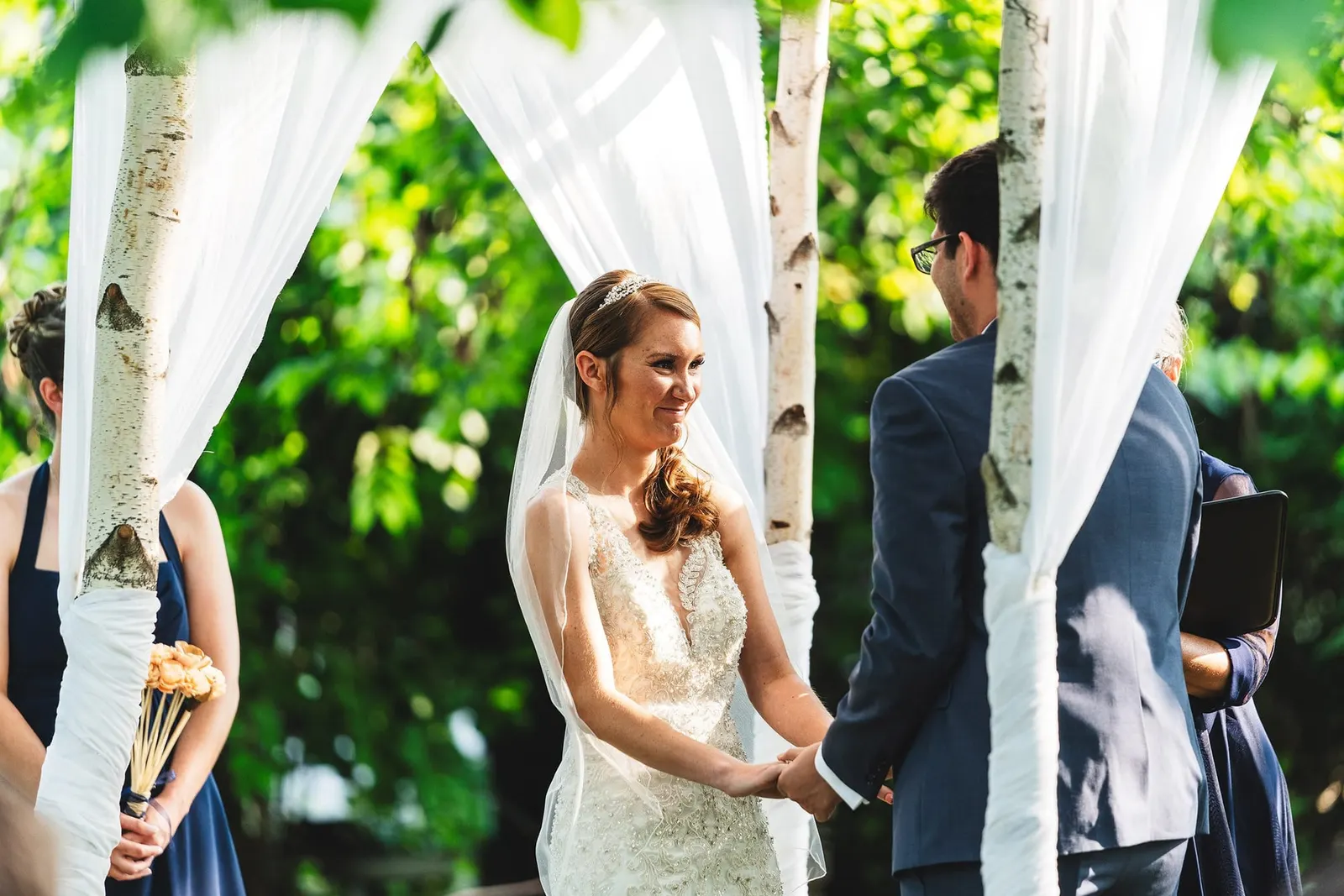Bride smiling at the groom during the ceremony