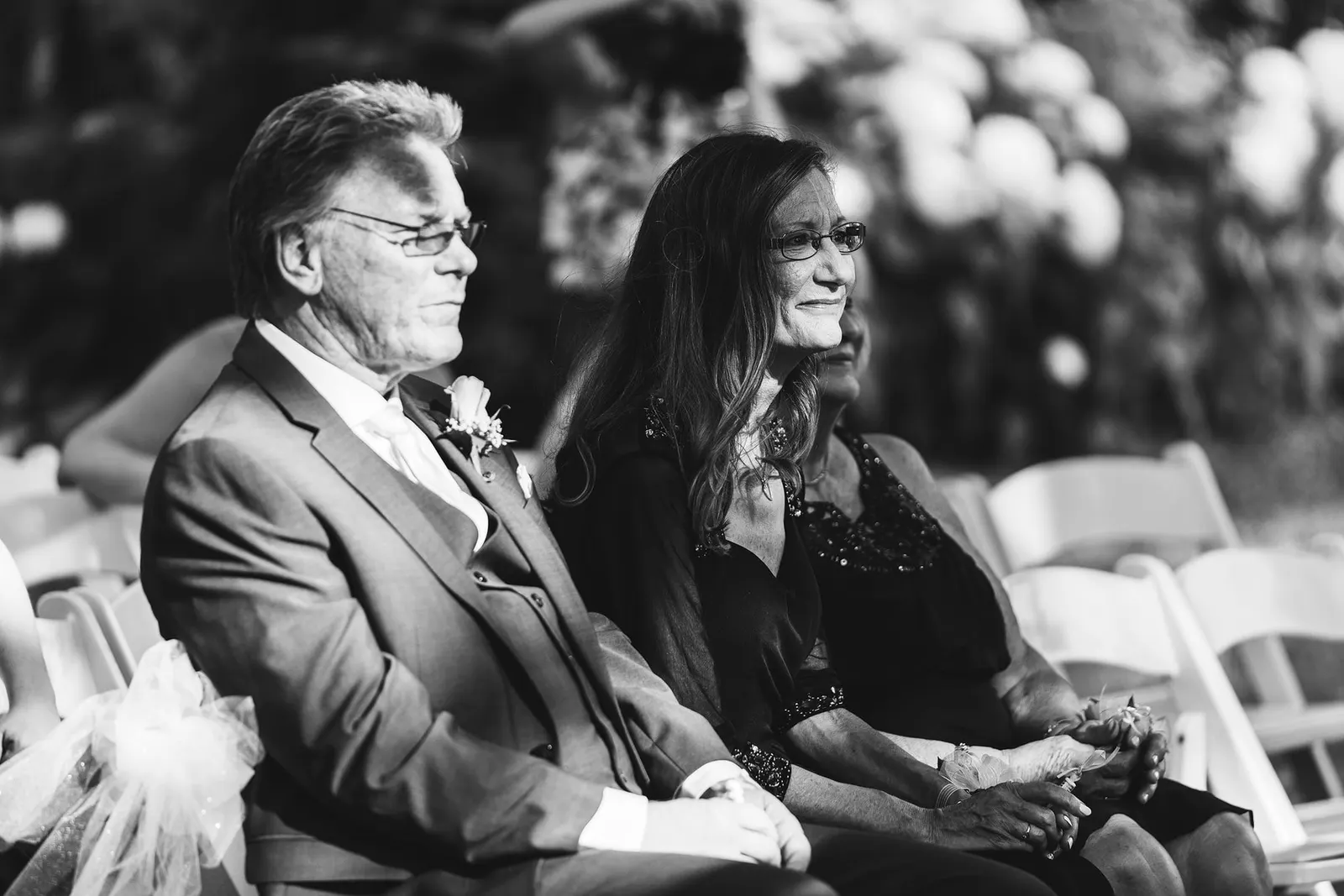 Black and white photo of family watching the ceremony