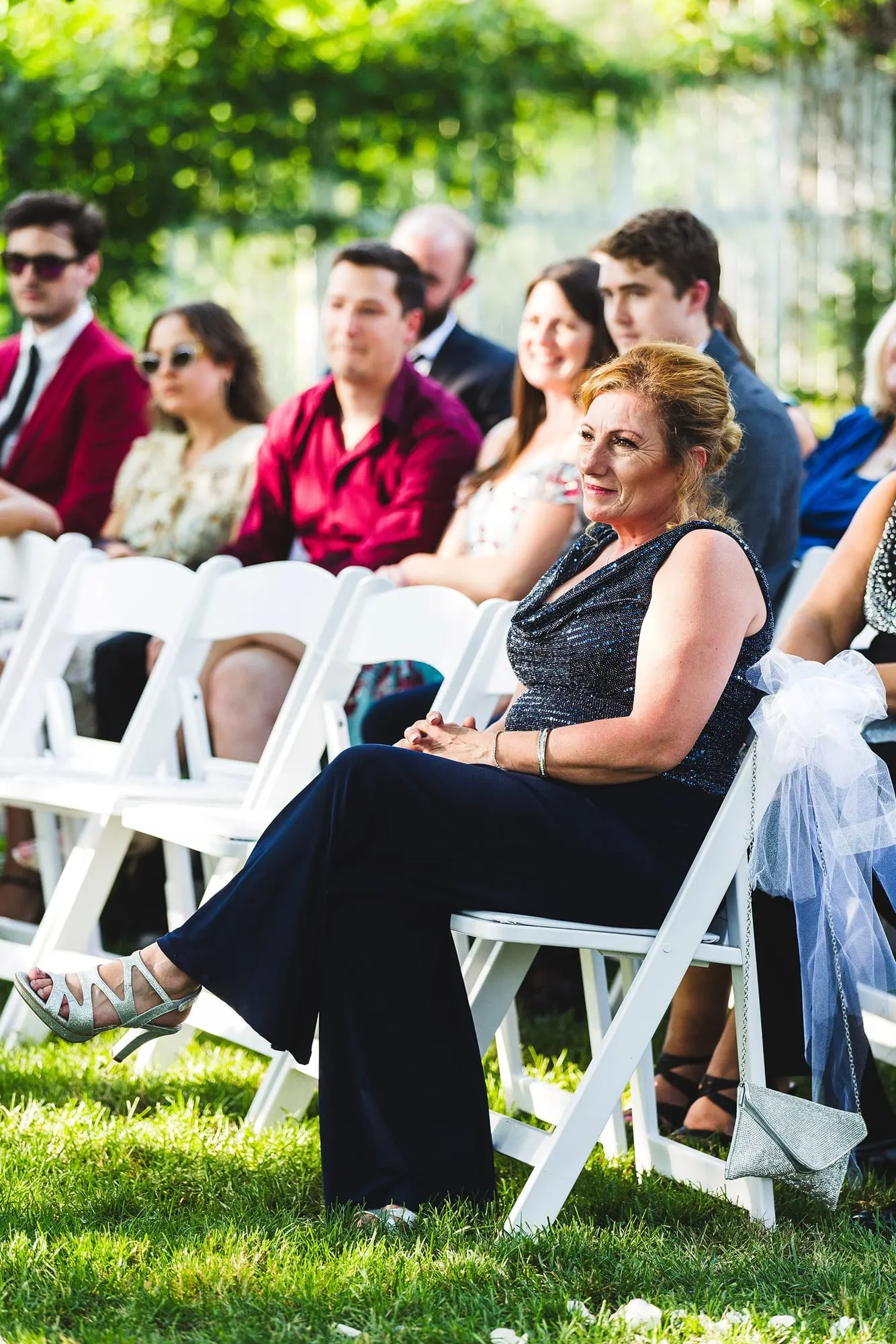 Guest watching the ceremony from her seat