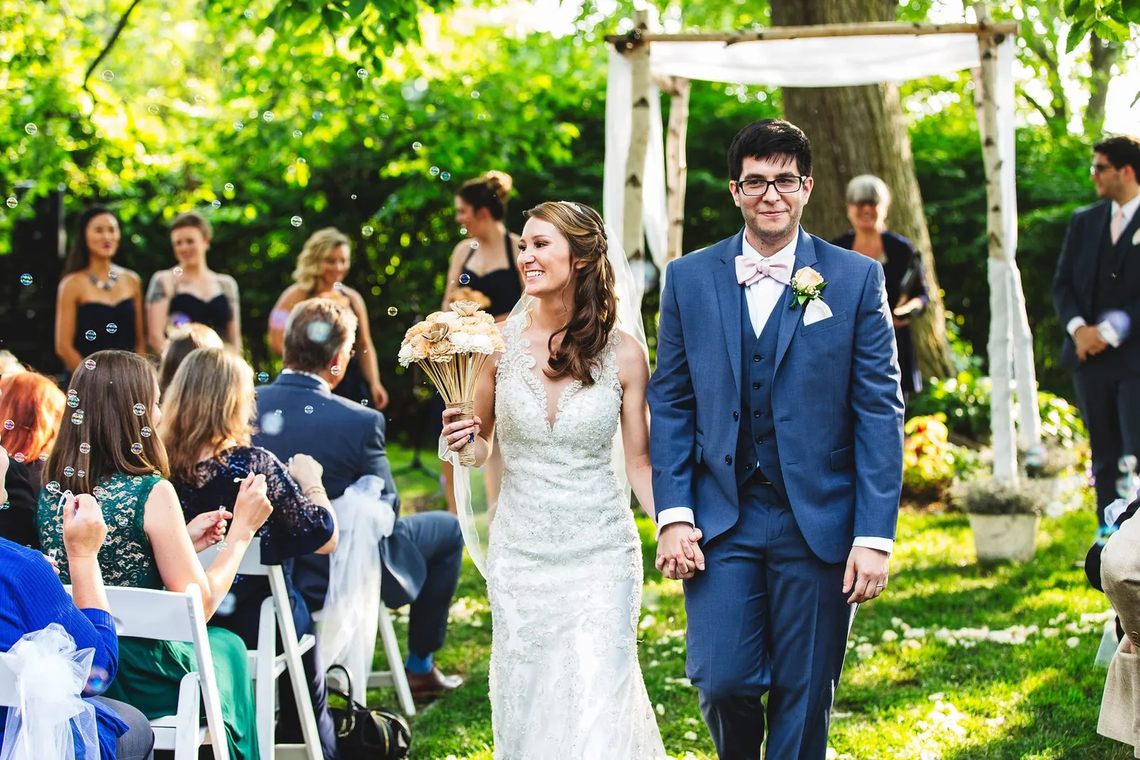Joyful recessional past the wedding party