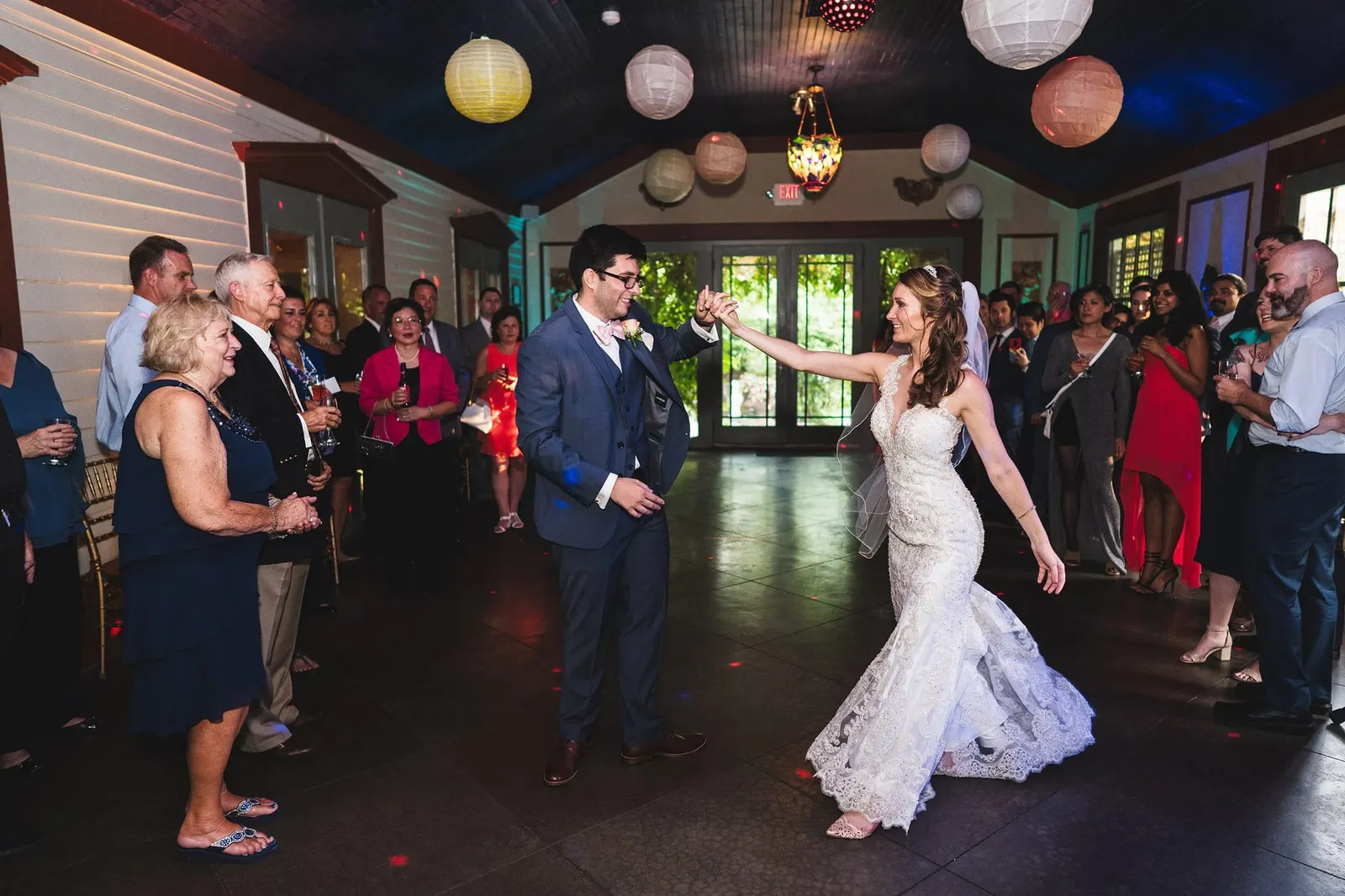 Bride and groom dancing into the reception