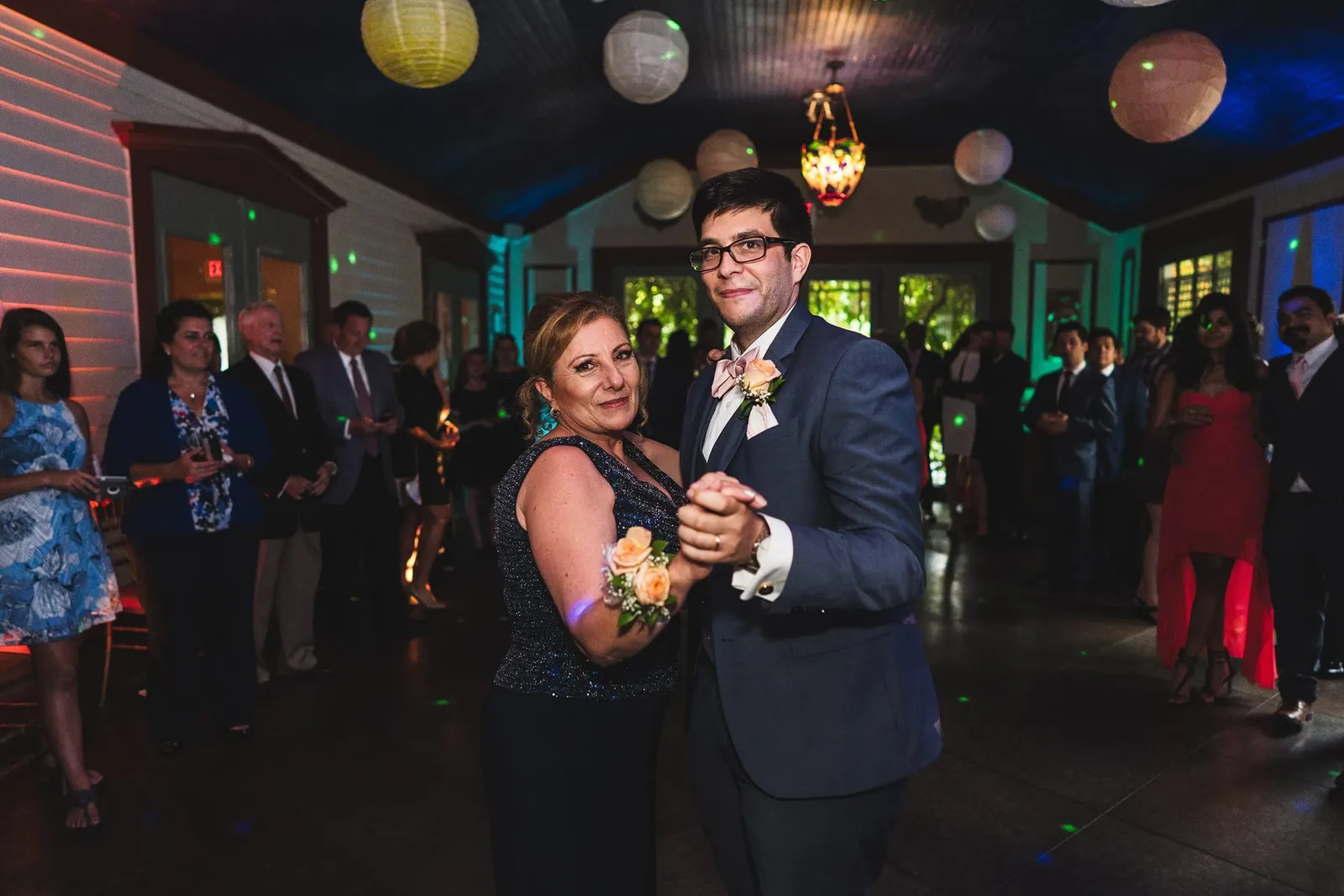 Groom dancing with a family member