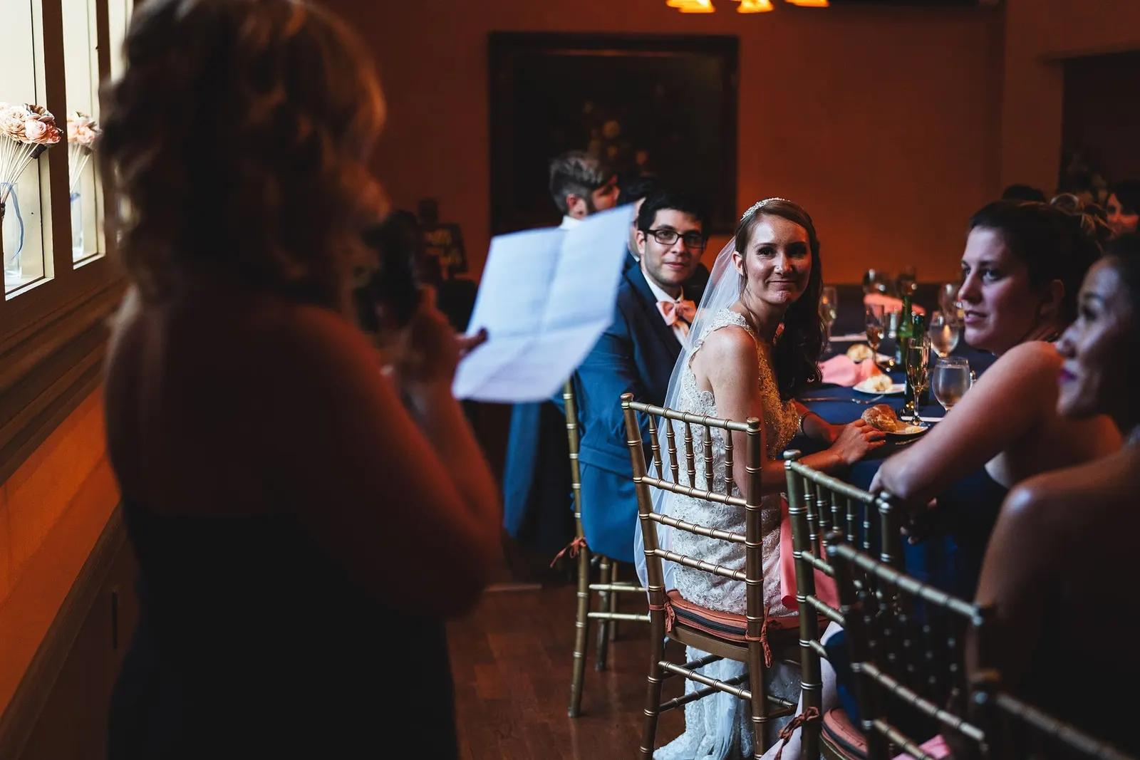 Guest reading a toast to the bride and groom