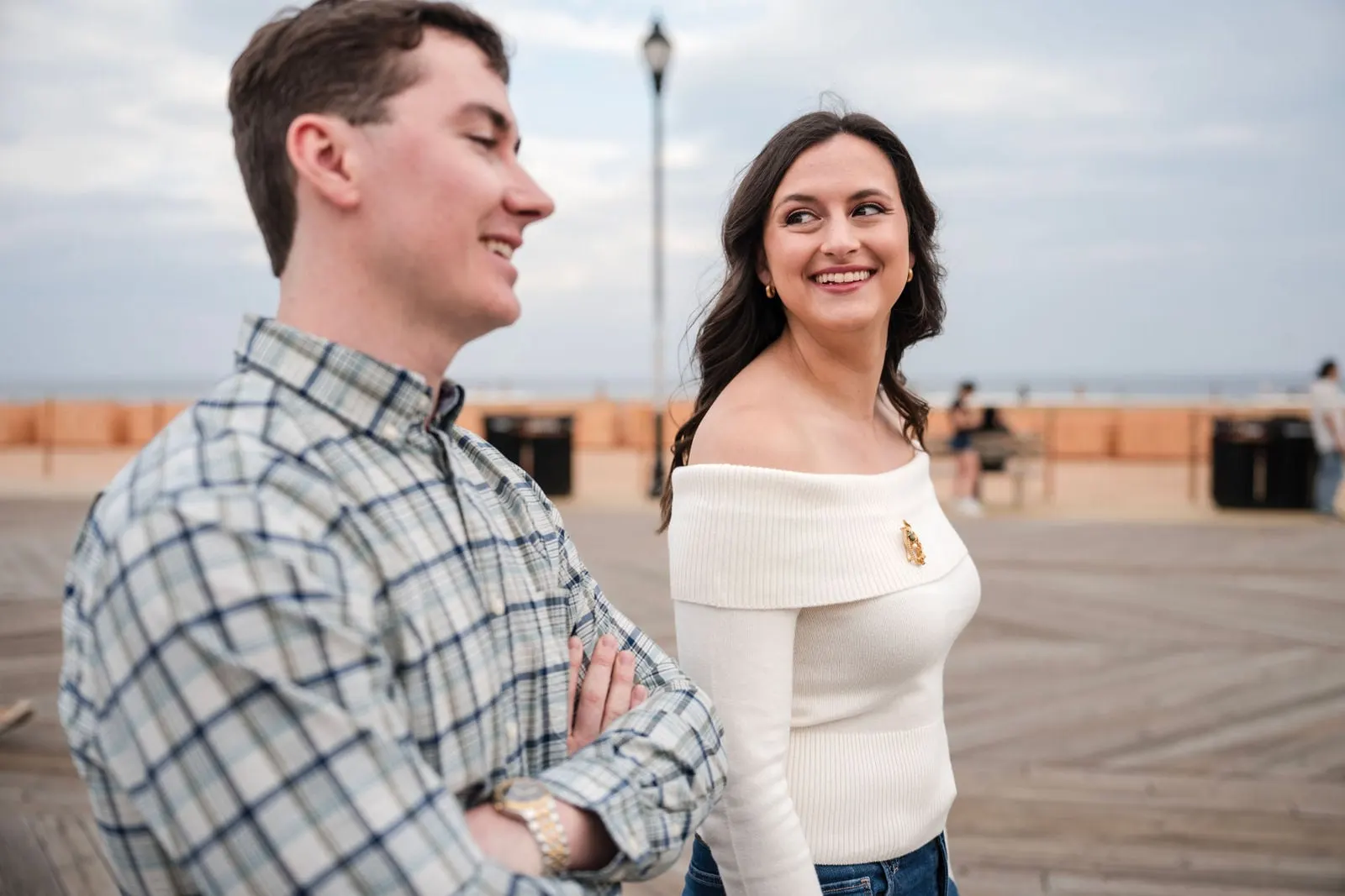 Couple laughing on the Asbury Park boardwalk