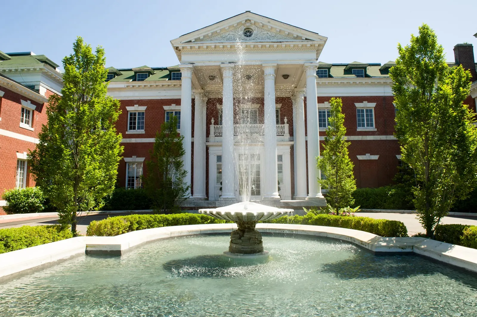 Bourne Mansion's columned entrance and fountain in Oakdale, Long Island