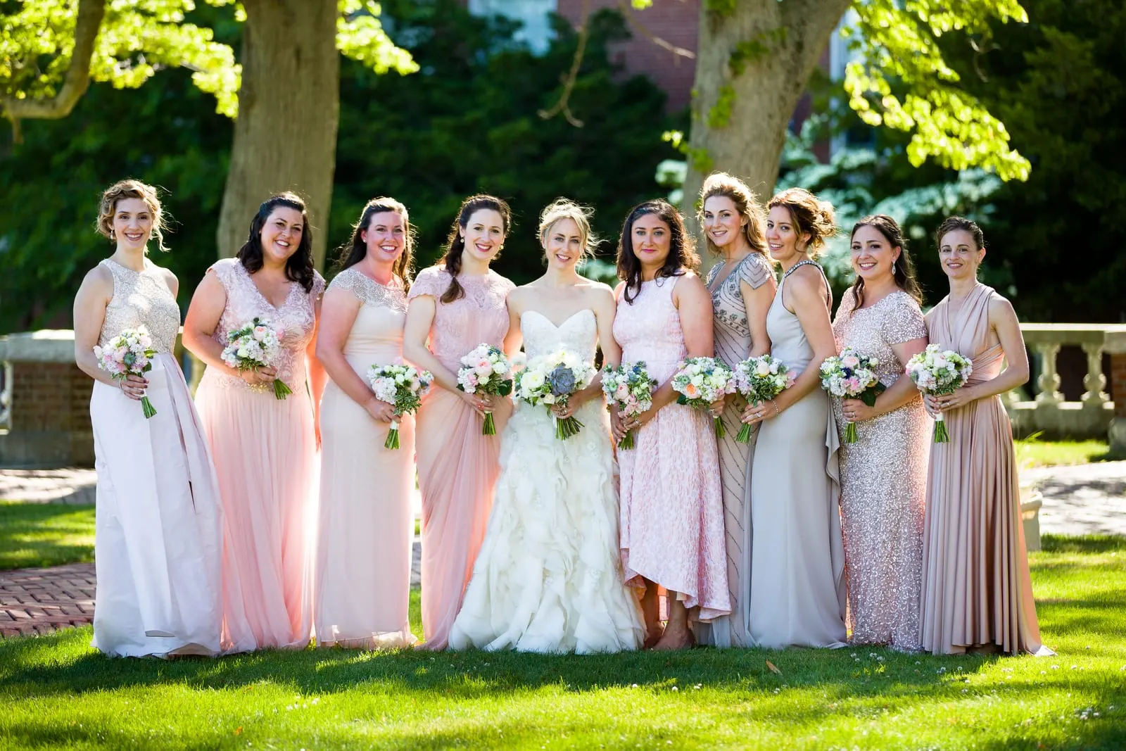 Bride with her bridesmaids in blush and ivory gowns