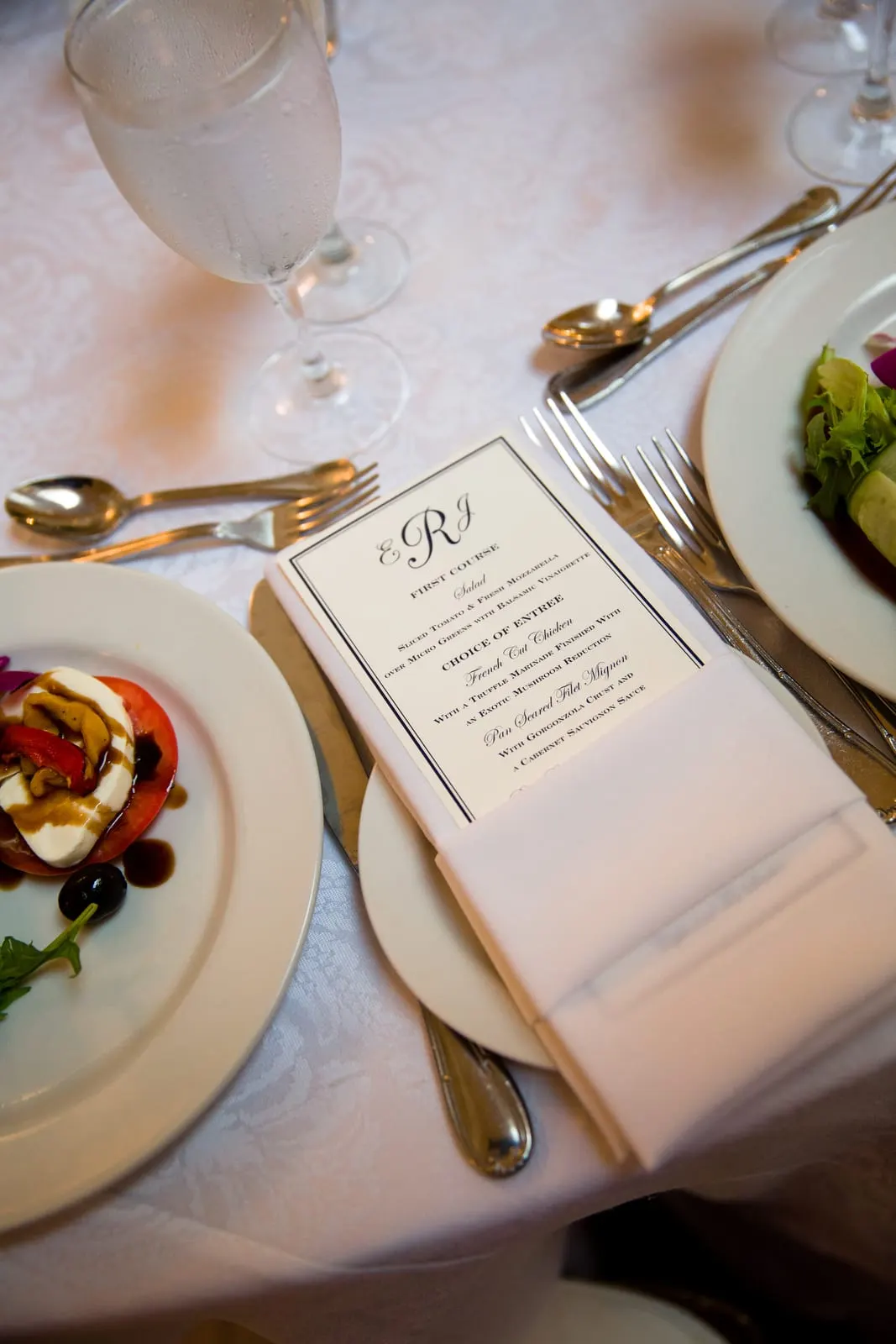 Monogrammed menu card on a reception place setting