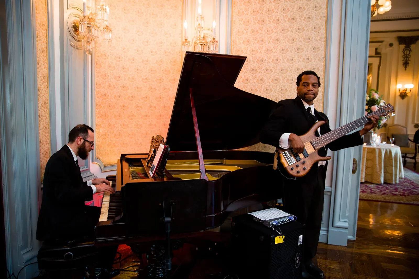 Pianist and bassist playing during cocktail hour