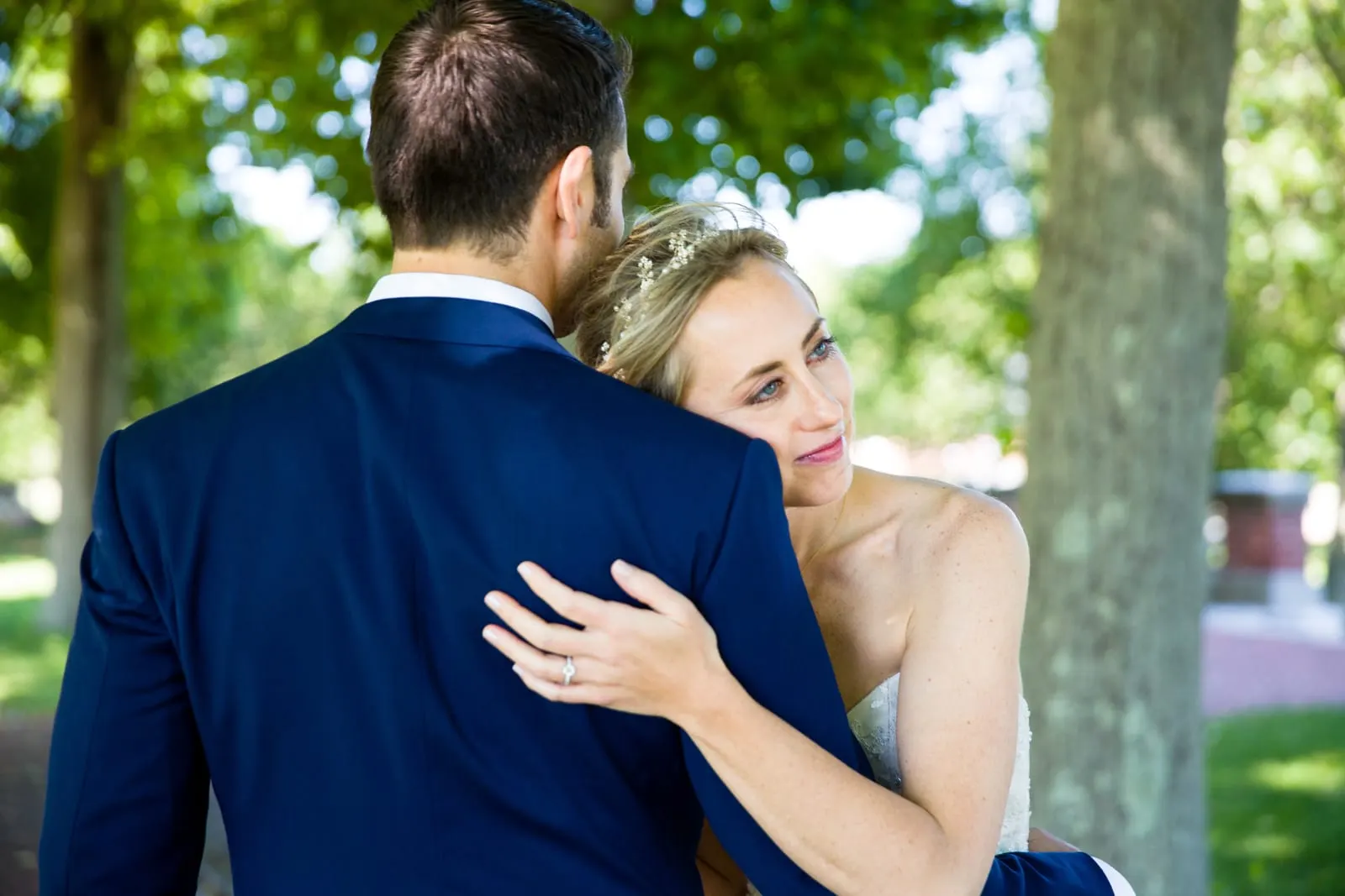 Bride resting her head on the groom's shoulder