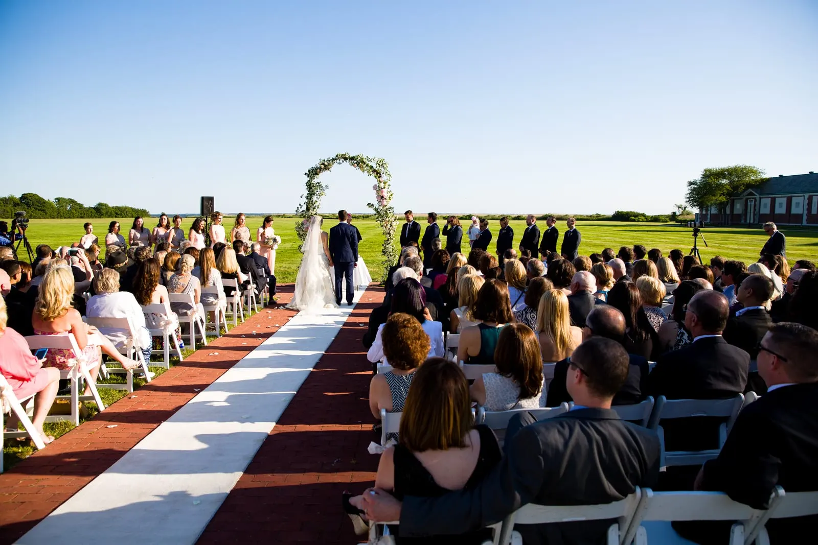 Guests seated on the lawn during the ceremony