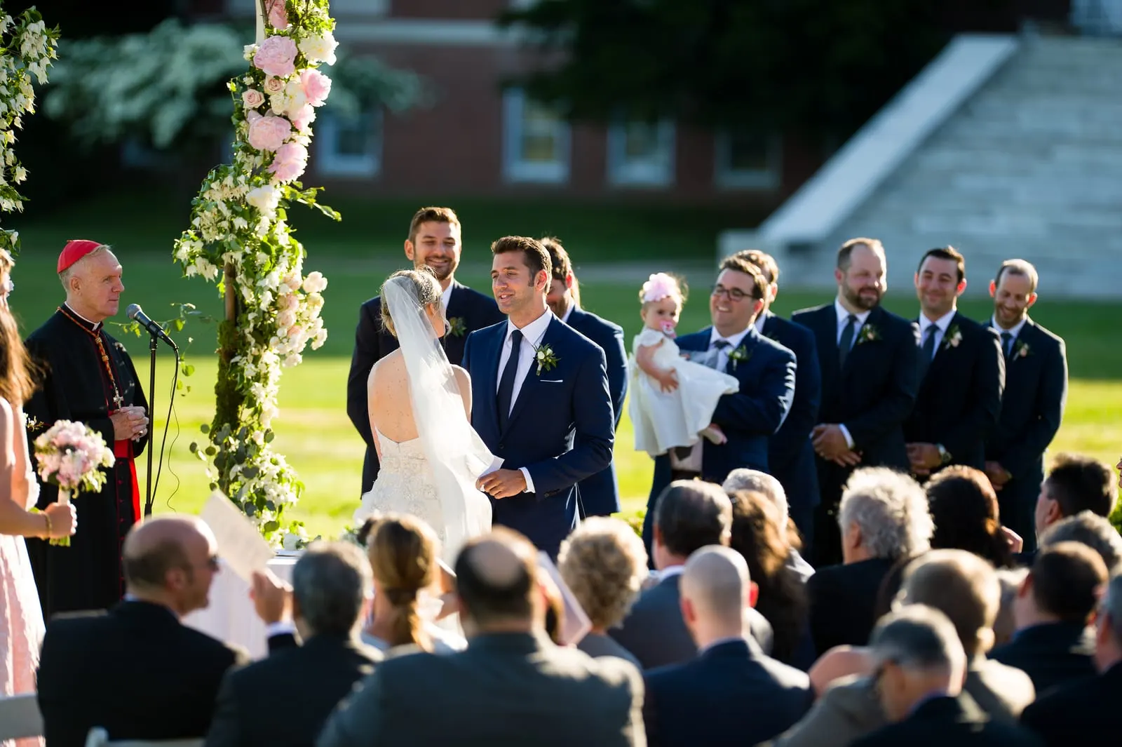 Bride and groom facing each other at the altar