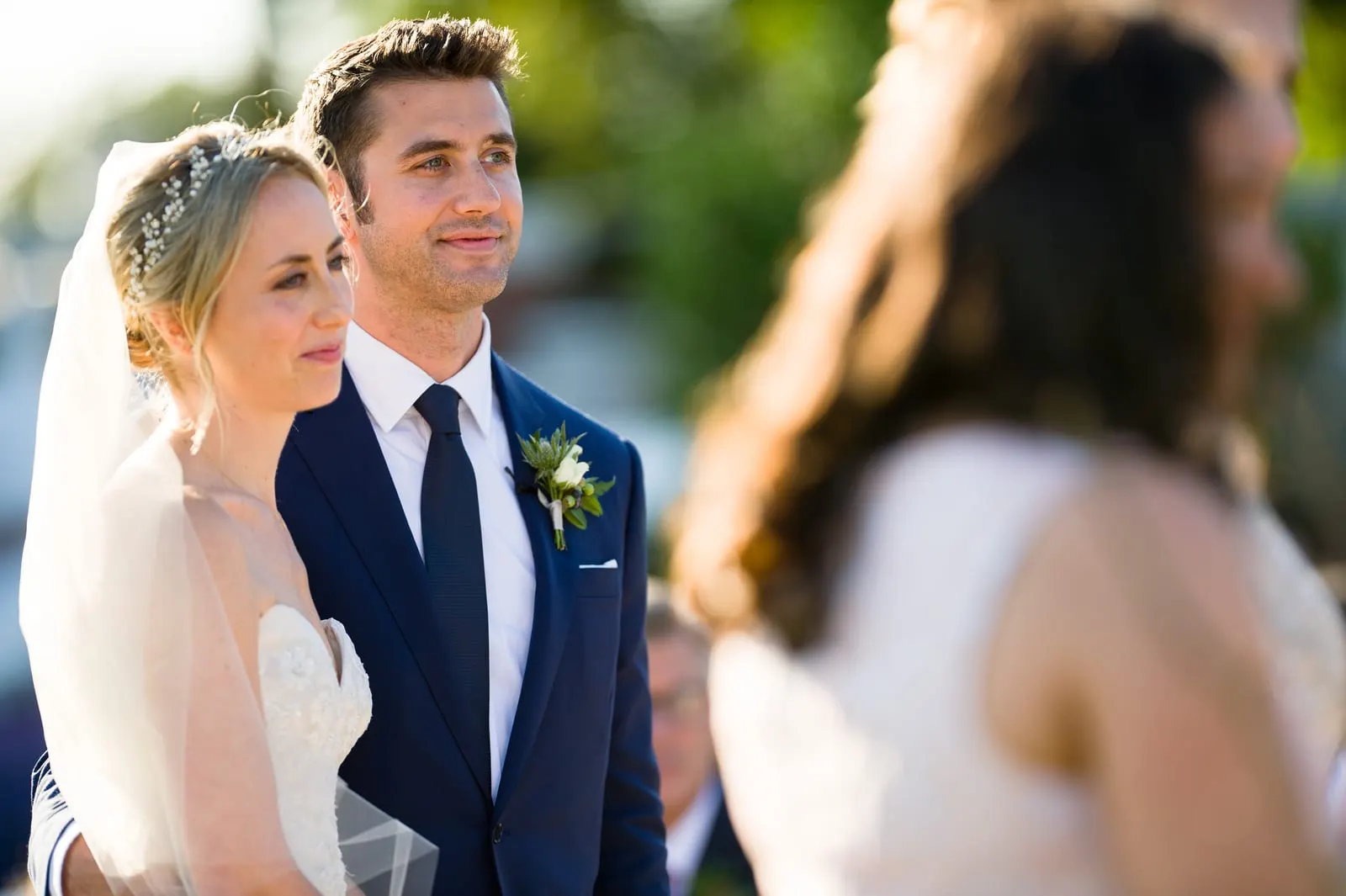 Bride and groom smiling during the ceremony