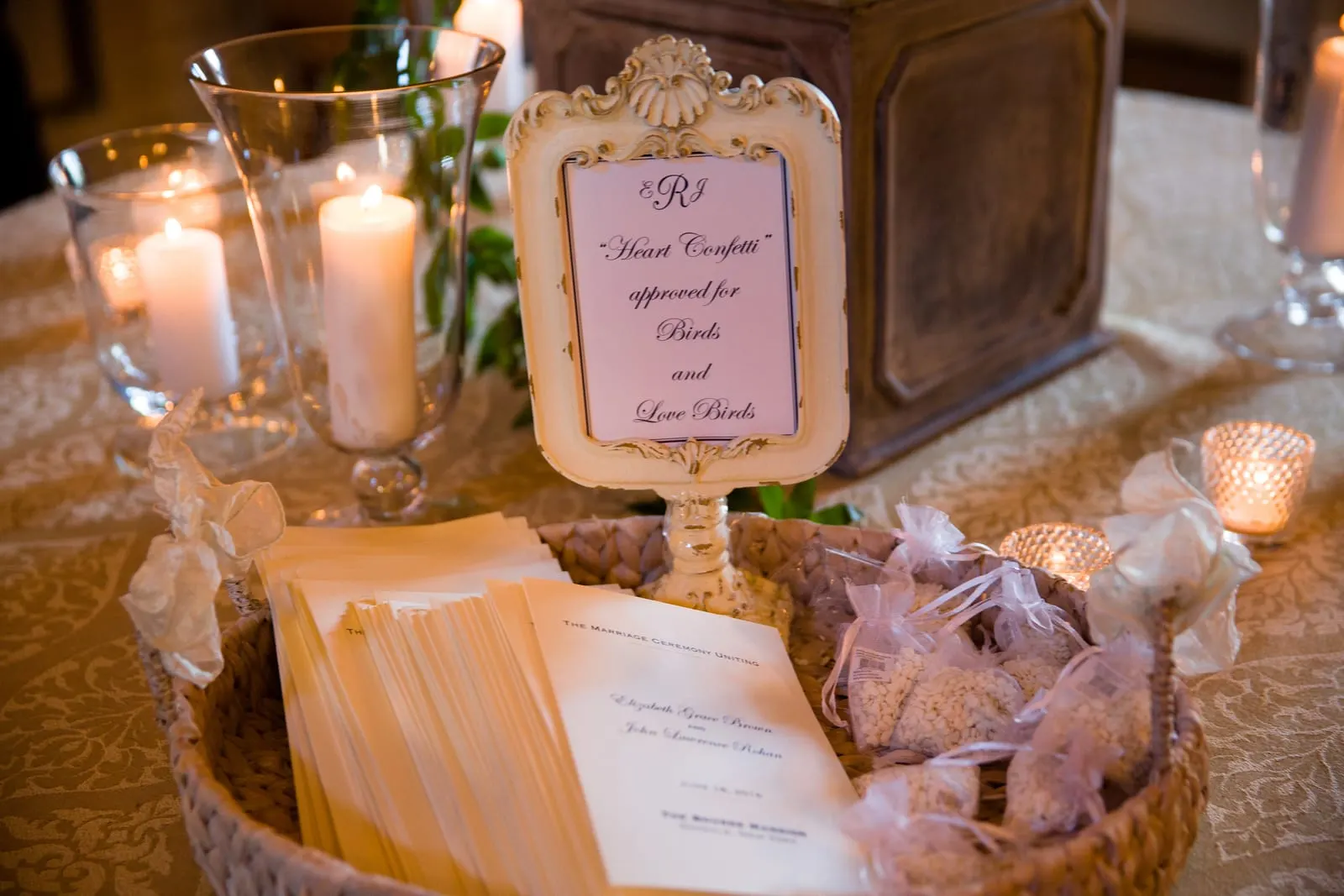 Candlelit escort cards on a table