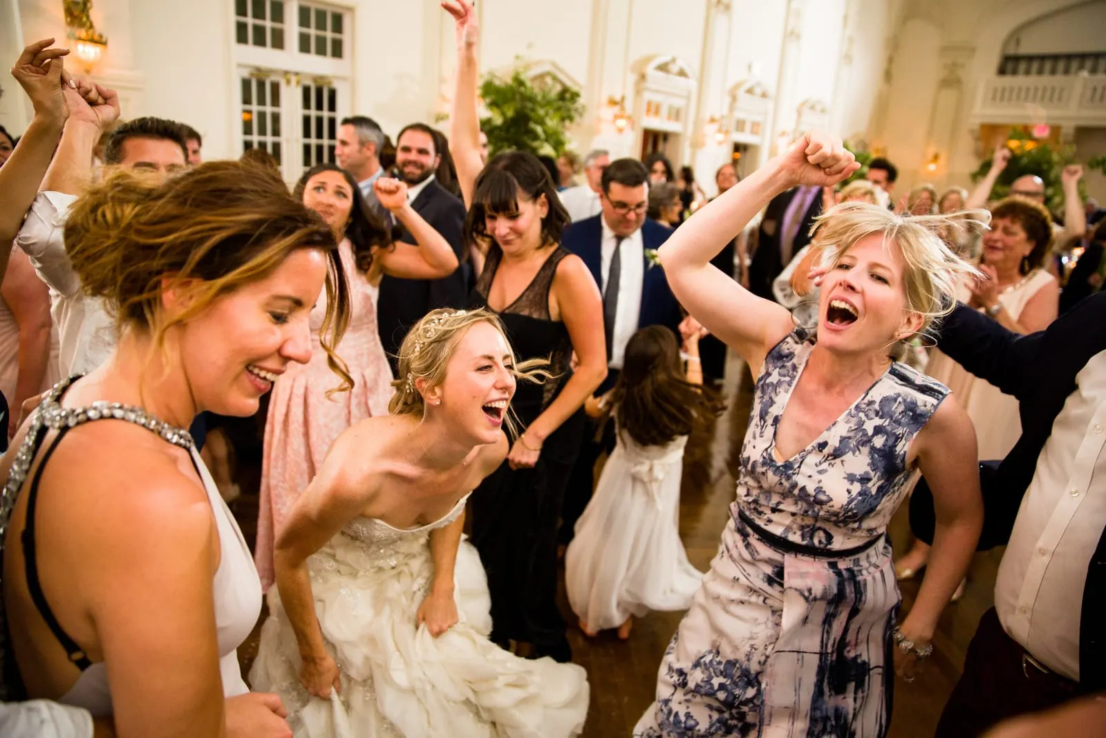 Guests singing and dancing with the bride
