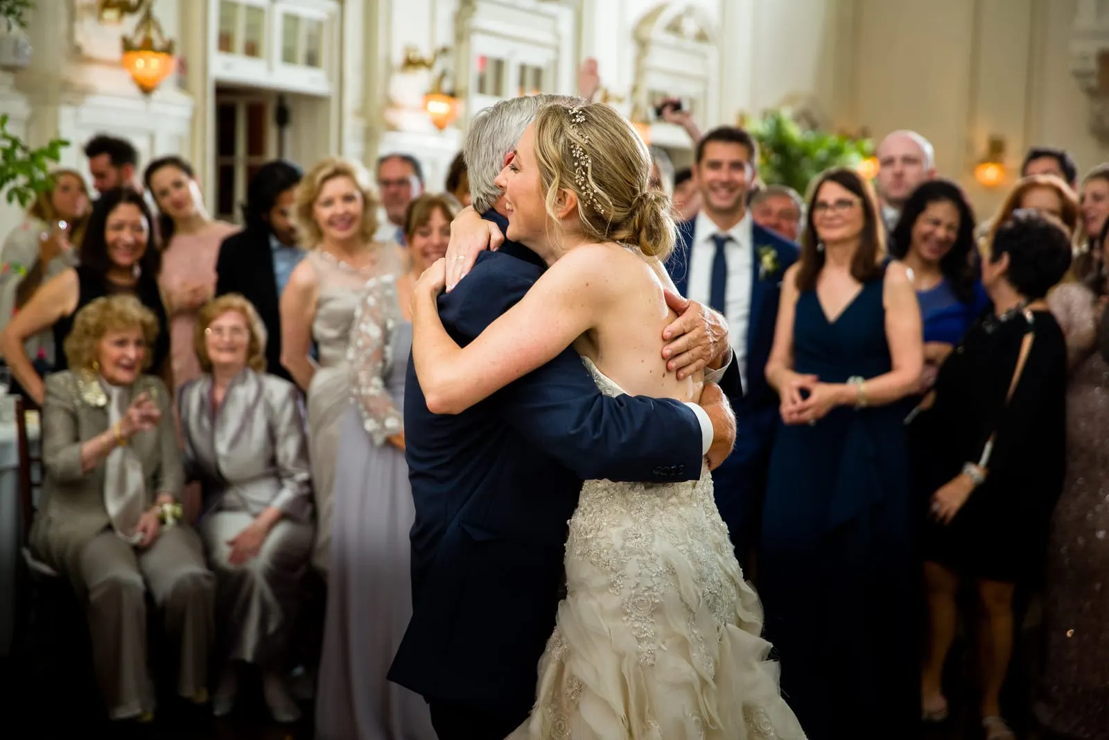 Bride hugging a guest on the dance floor