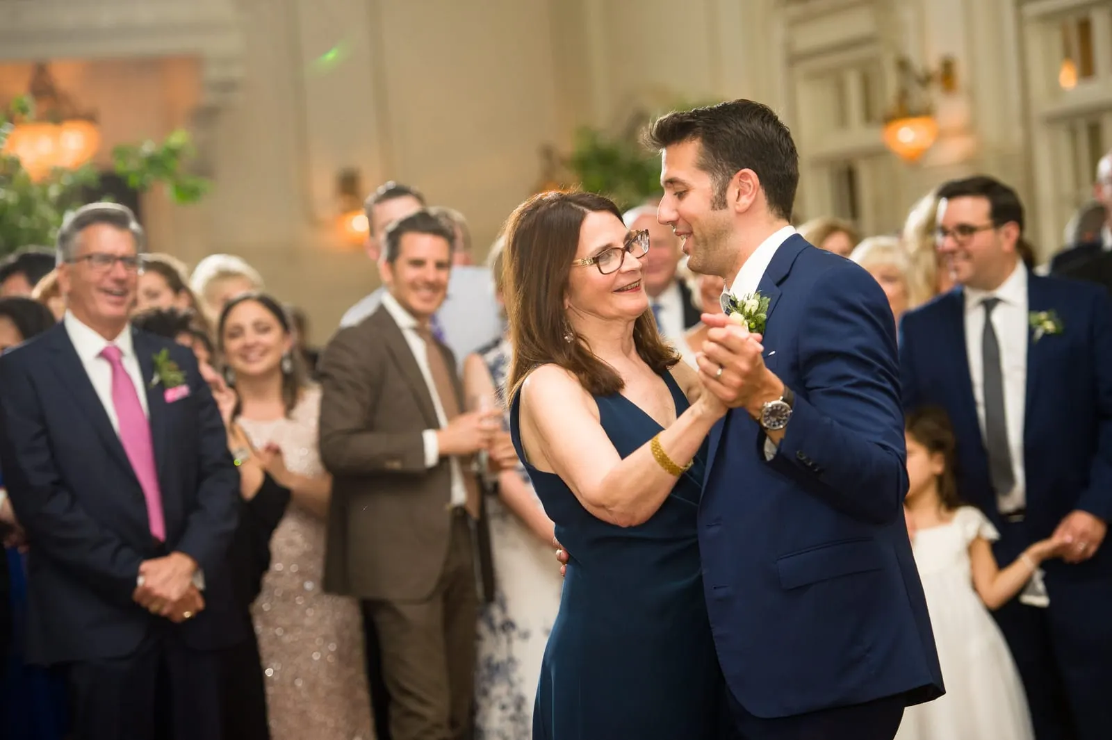 Groom dancing with a guest