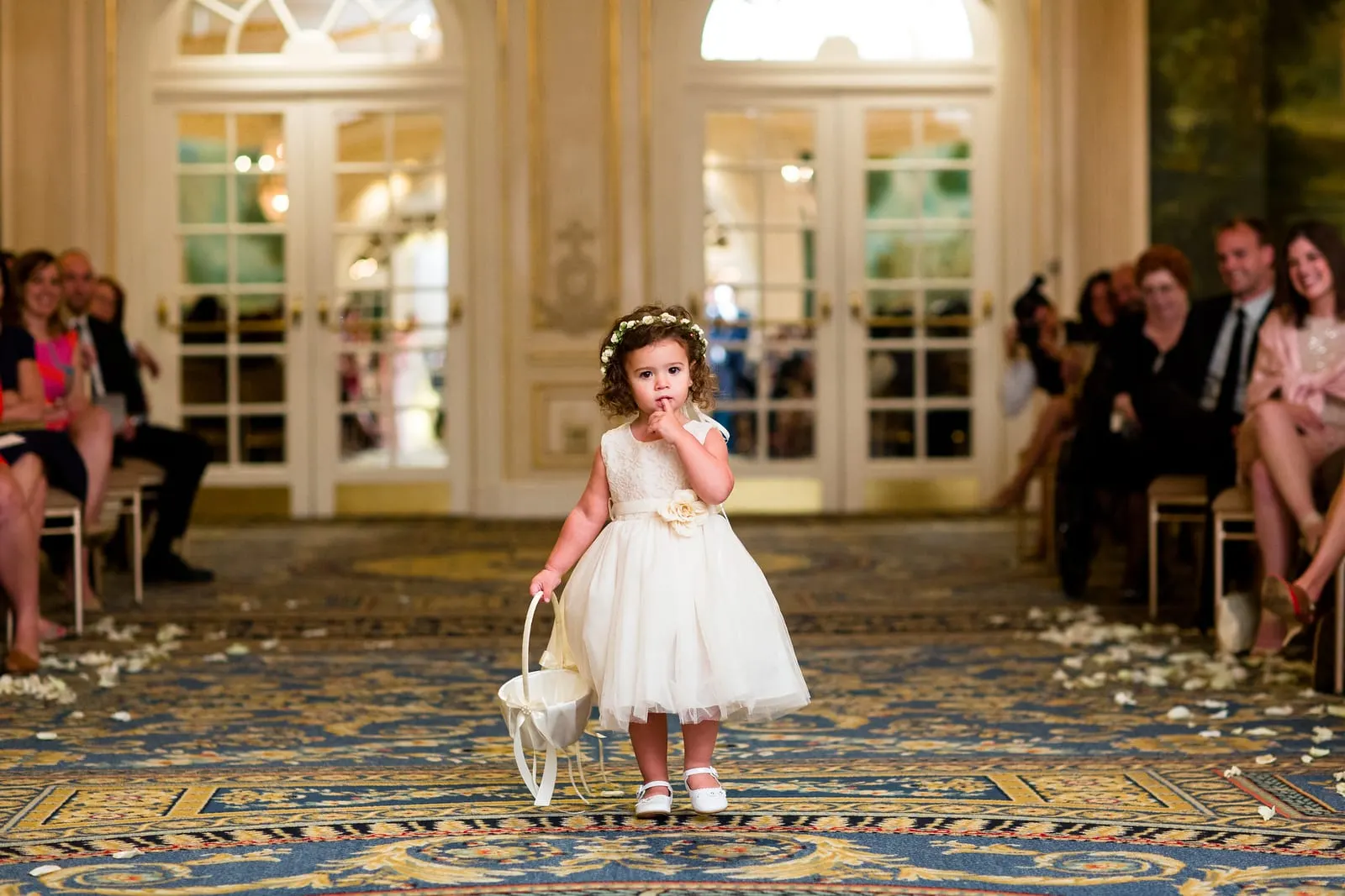 Flower girl walking down the aisle