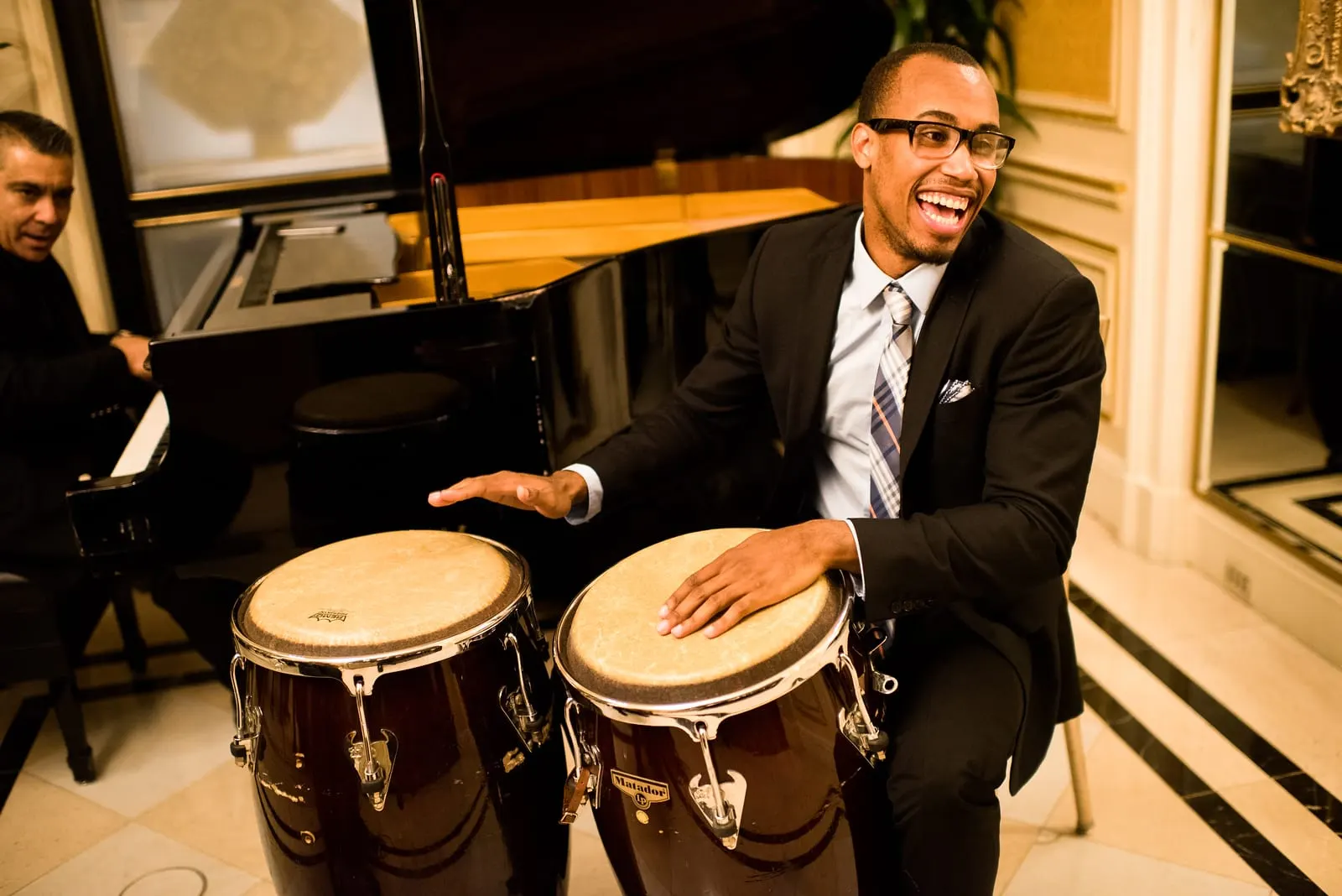 Conga player performing during cocktail hour