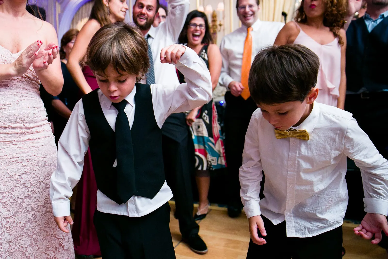 Young guests dancing on the dance floor