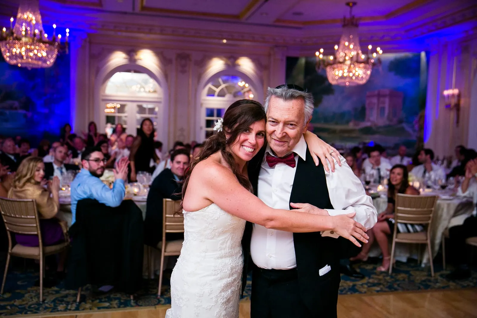 Bride dancing with a family member