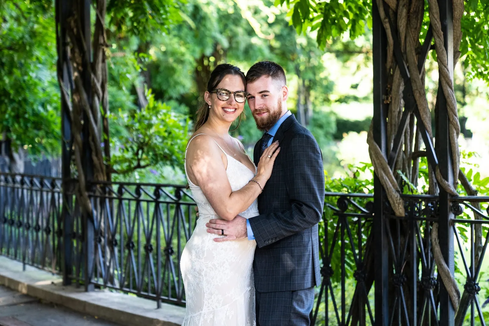 Bride and groom embracing in the Conservatory Garden, Central Park