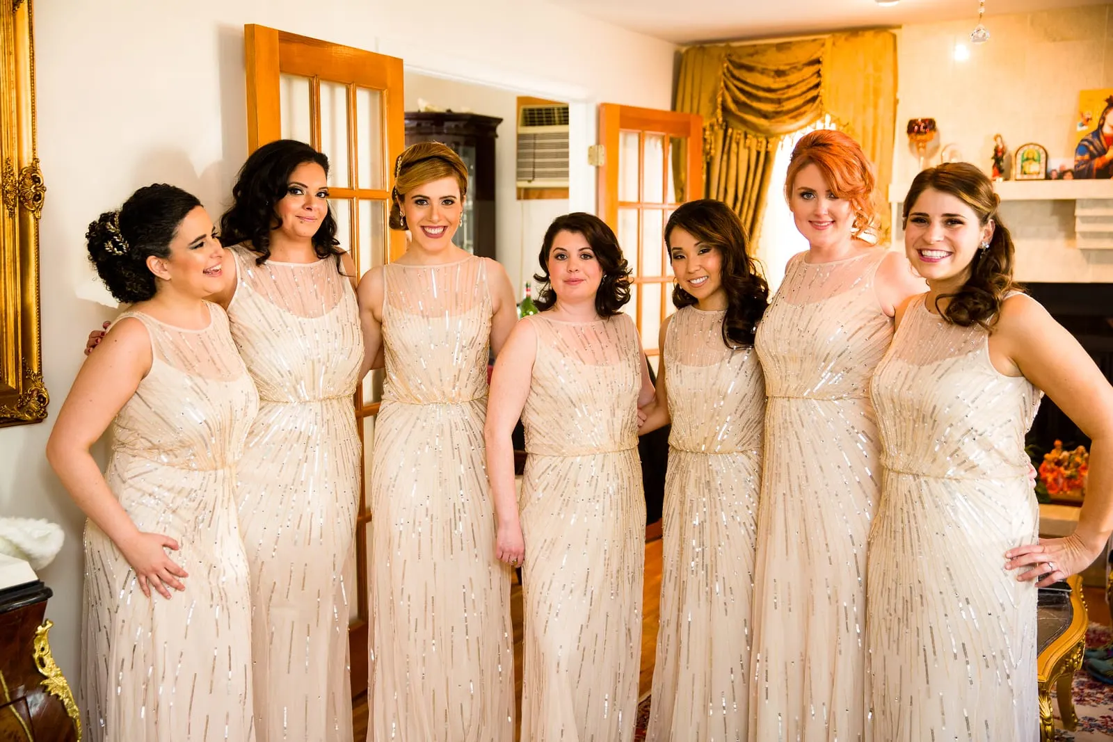 Bridesmaids in champagne sequined gowns