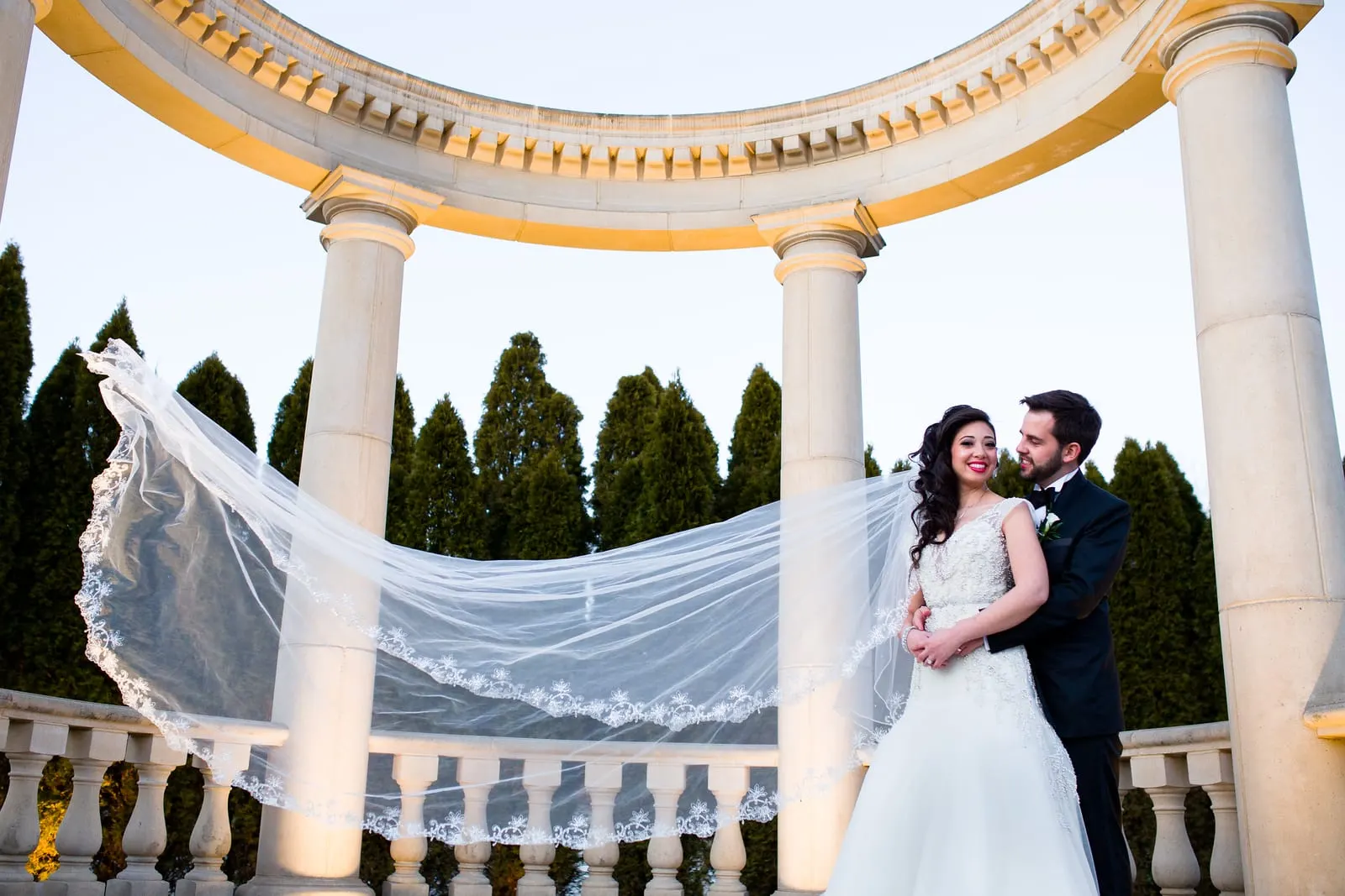 Bride's cathedral veil floating across the rotunda at Rockleigh Country Club