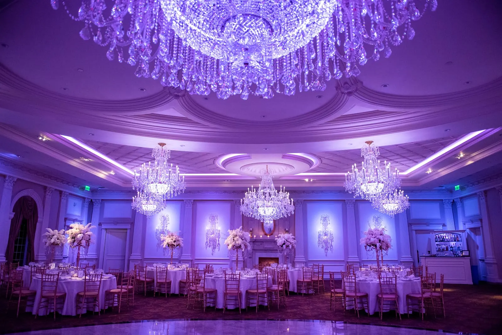 Rockleigh Country Club ballroom glowing under crystal chandeliers before the reception