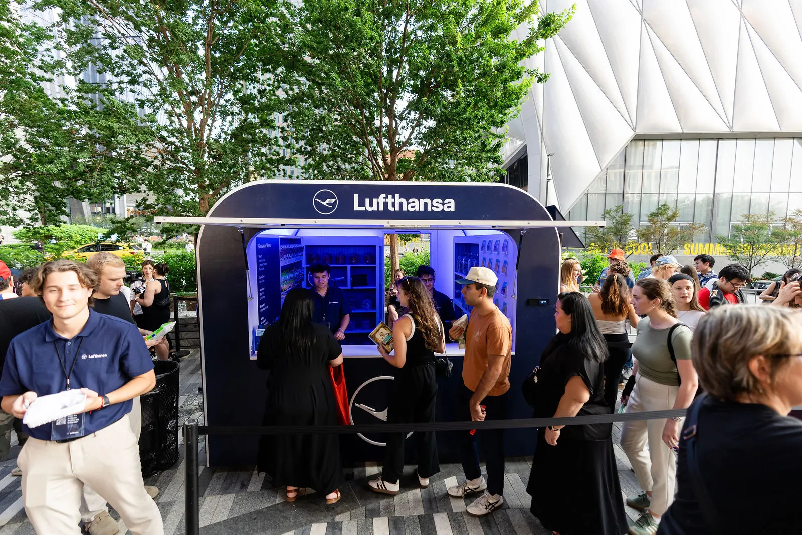 Guests lining up at the Lufthansa booth at Hudson Yards beside The Shed