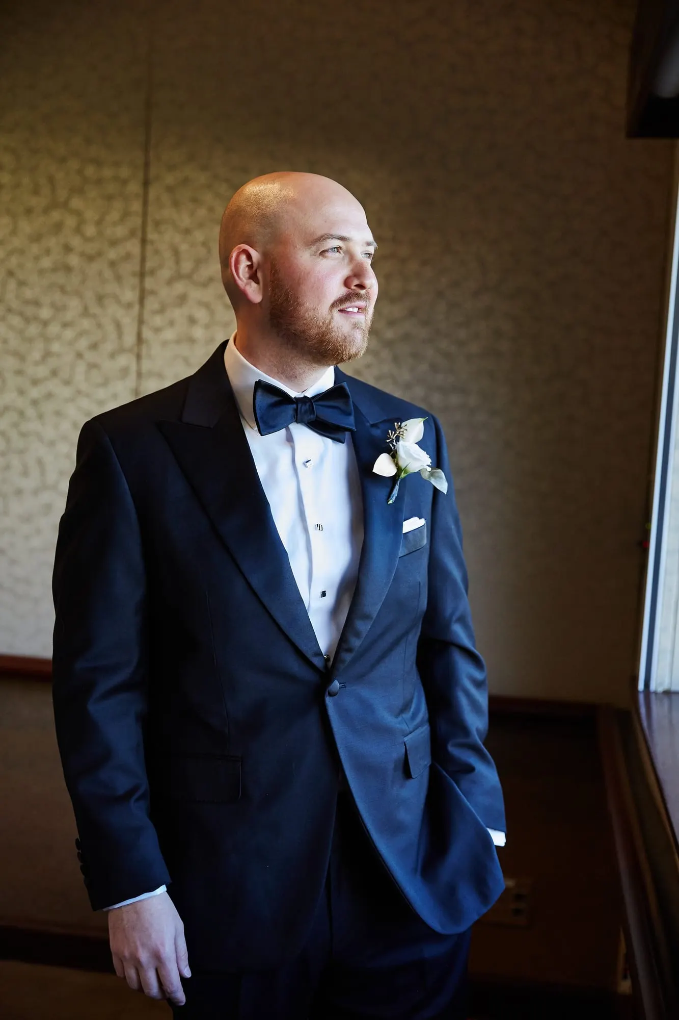 Groom in a navy tuxedo before his wedding at Doral Arrowwood in Rye Brook, New York