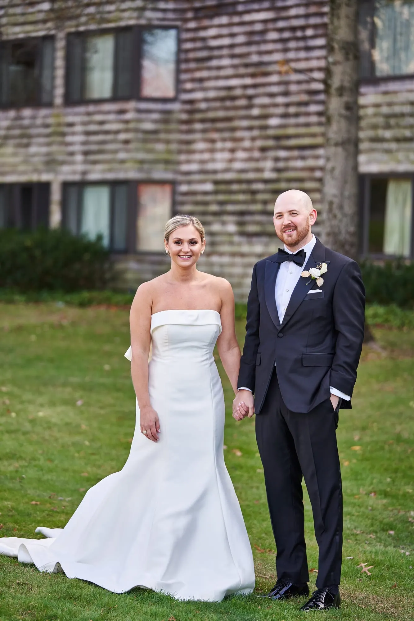 Bride and groom portrait on the lawn at golden hour