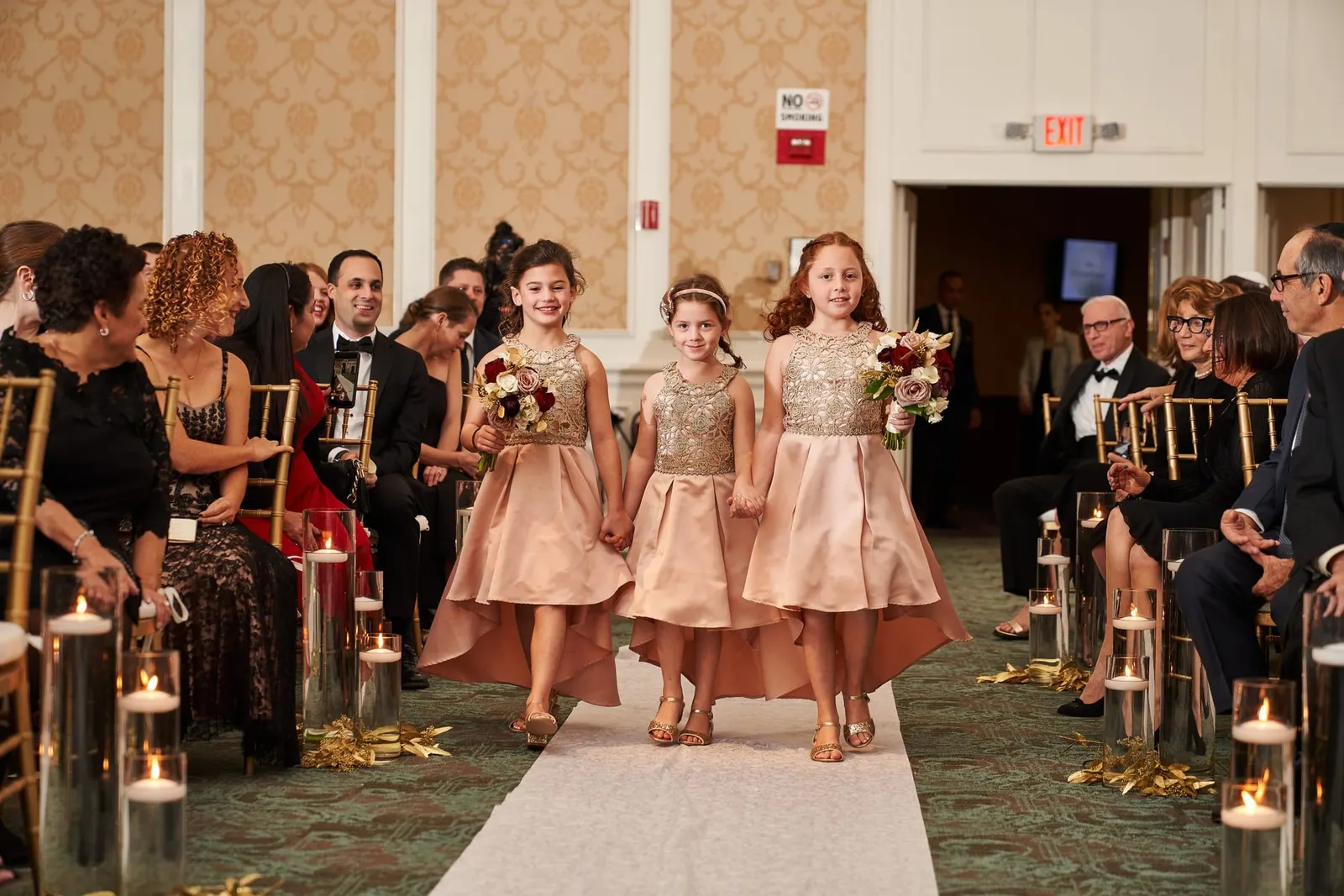Flower girls walking down the aisle