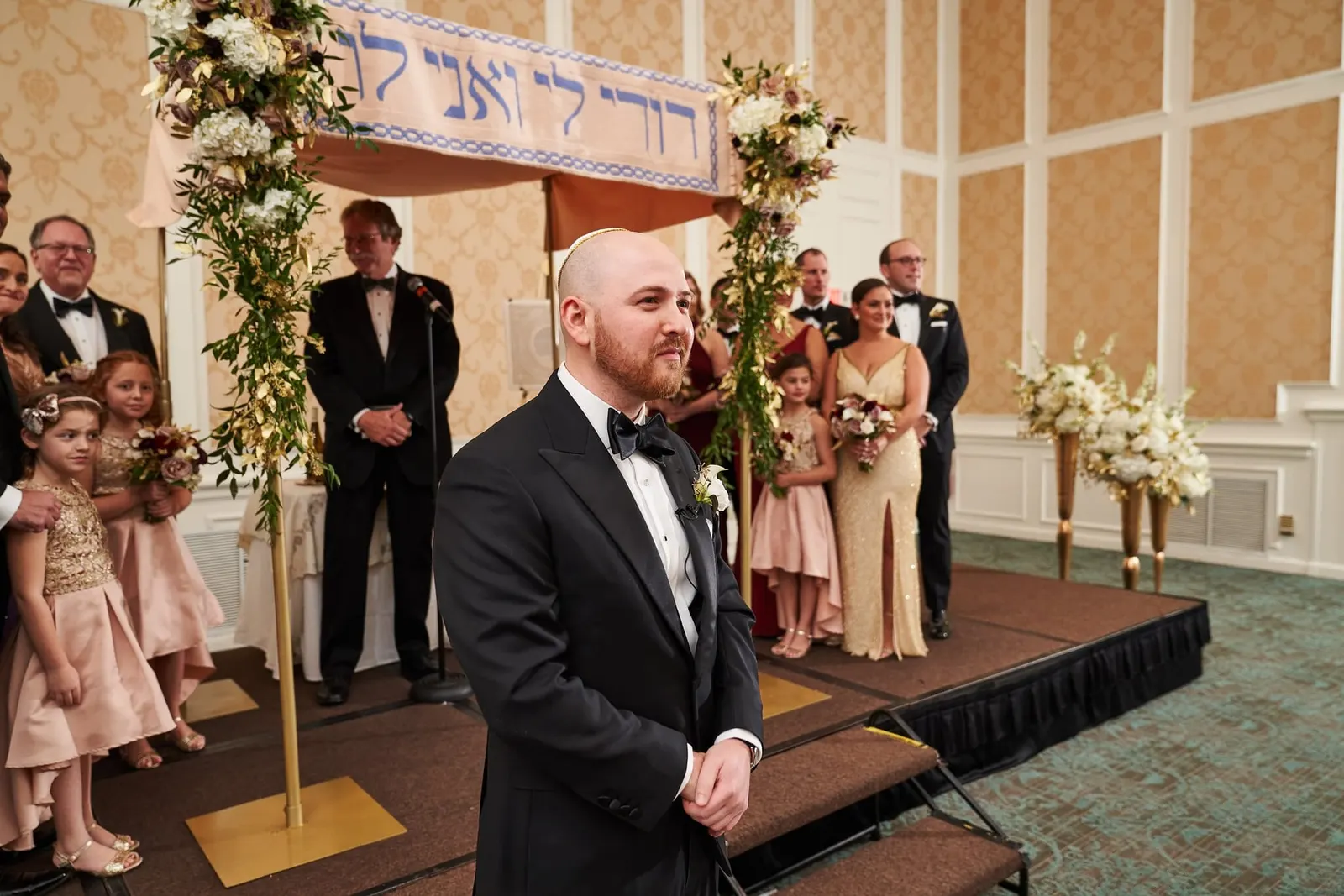 Groom waiting at the chuppah