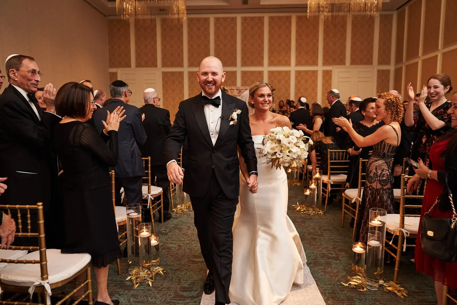 Newlyweds walking back down the aisle after the ceremony