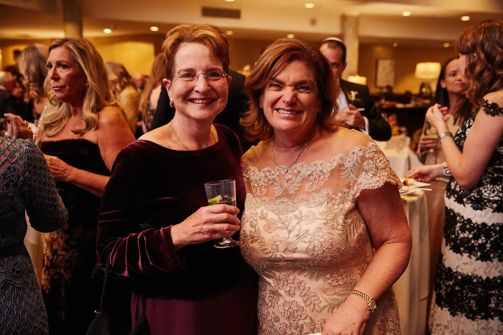 Guests laughing together during cocktail hour