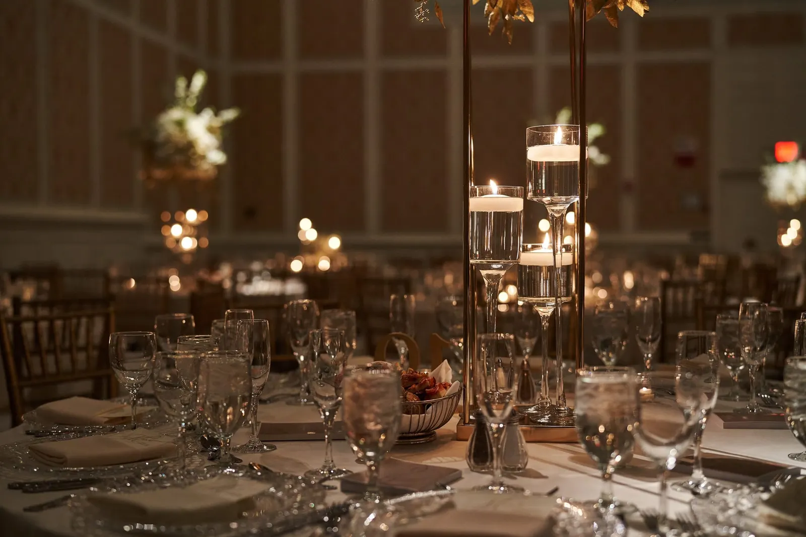 Candlelit ballroom set for the wedding reception