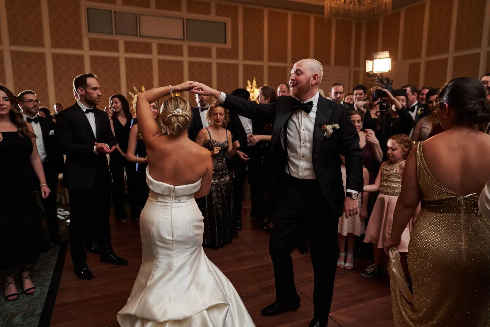 Bride dancing with guests