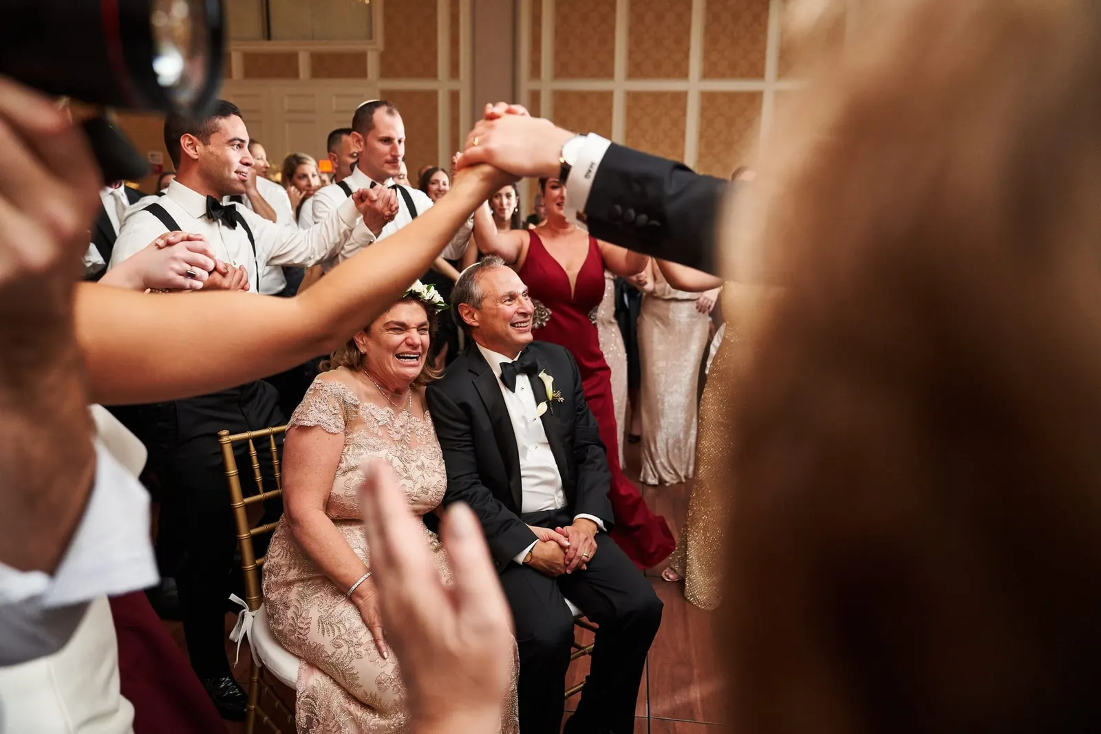 Guests dancing around the couple