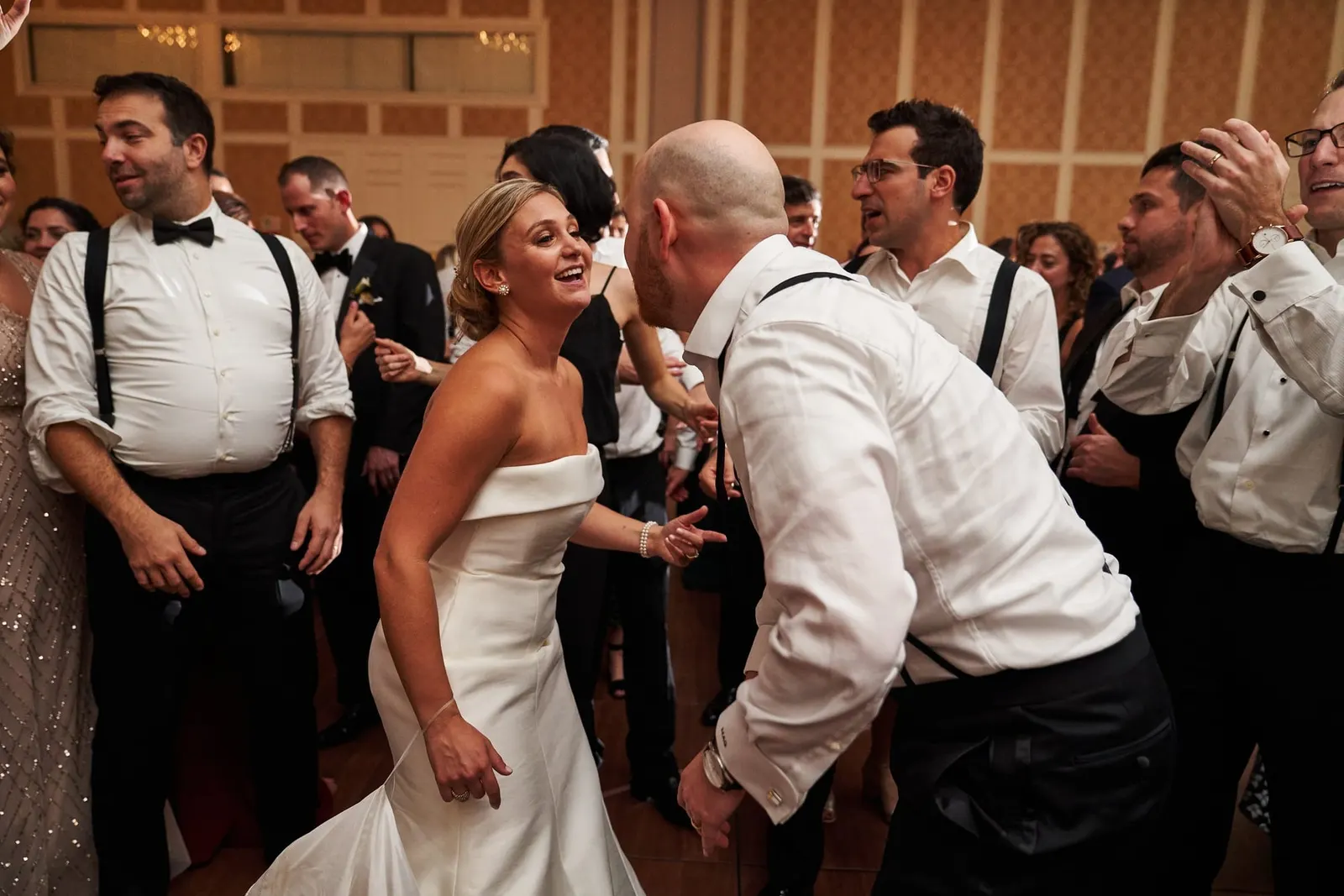 Bride dancing with guests at the end of the night