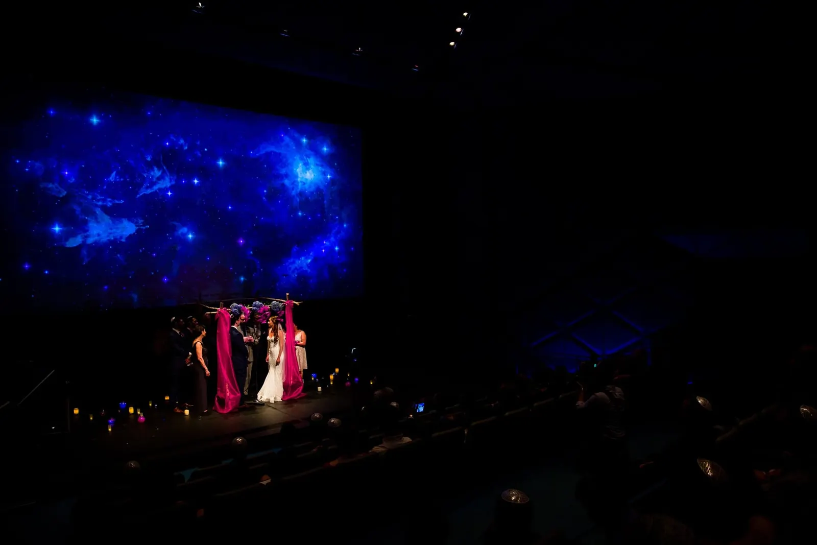 Jewish wedding couple under the chuppah in the theater at the Museum of the Moving Image